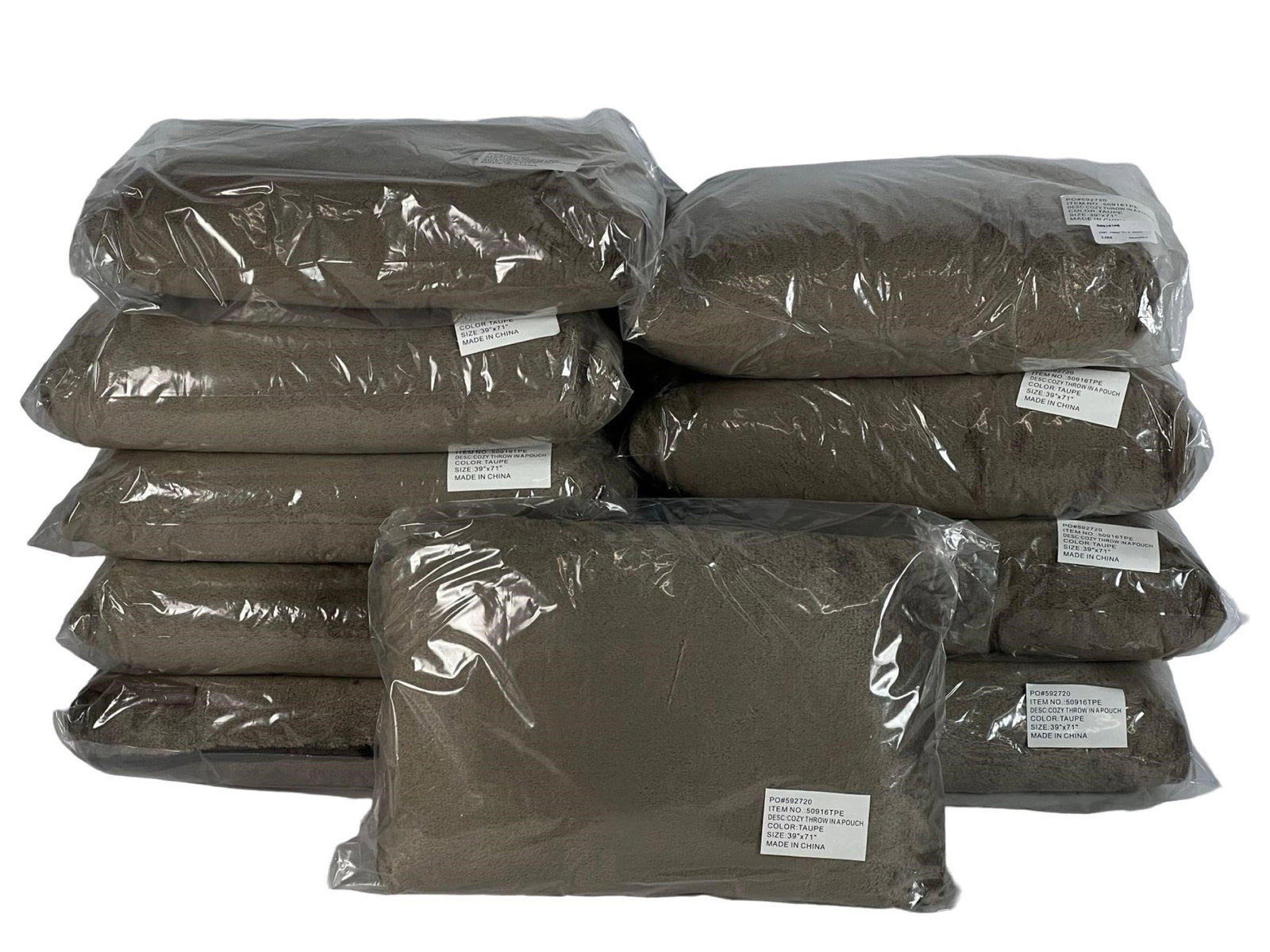 10 Pc Taupe Cozy Throws - 39"x71", New: Lot of 10 taupe-colored cozy throws in pouches. Soft and warm, perfect for home or travel. Size: 39" x 71" Color: TaupeAll are new-mint condition. Please review photos for details.