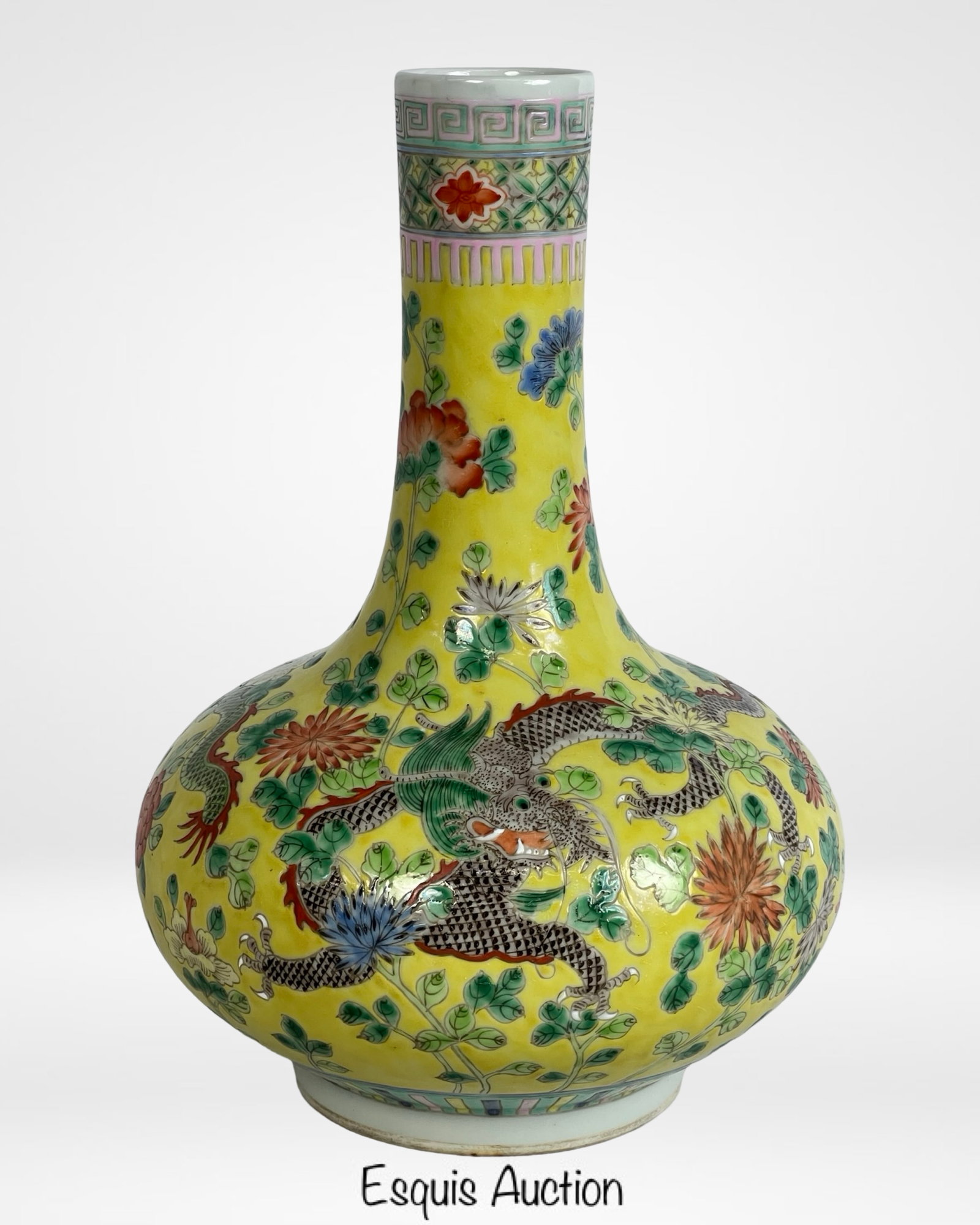 Antique Chinese Qing Dynasty Famille Rose Vase: Antique Chinese porcelain vase from the Qing Dynasty period, featuring a yellow ground famille rose palette with five-clawed dragons in pursuit of flaming pearls among floral vines. The globular body 