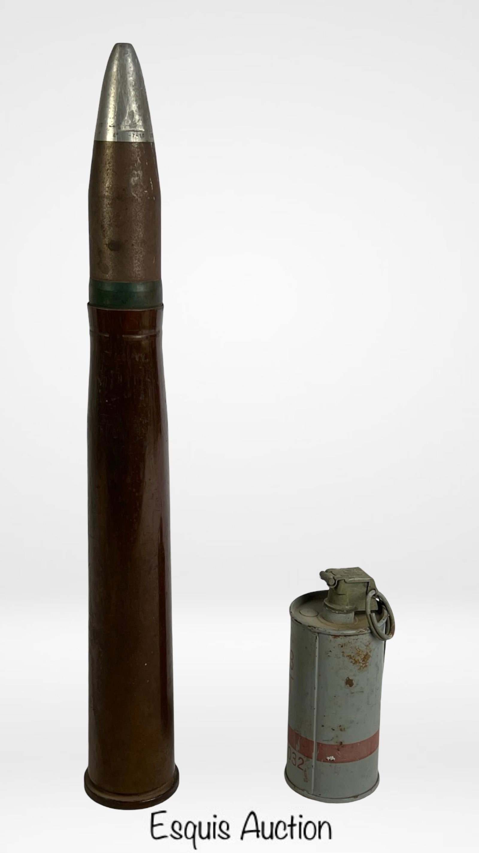 WWII U.S. Navy 40mm Dummy Gun Round & Grenade: Pair of original U.S. military inert dummies.1943a WWII U.S. Navy 40mm dummy round with stamped base "4CMM-MK3." Comes with M7A3 CS Riot grenade with original markings and M201A1 fuze. Both are comple