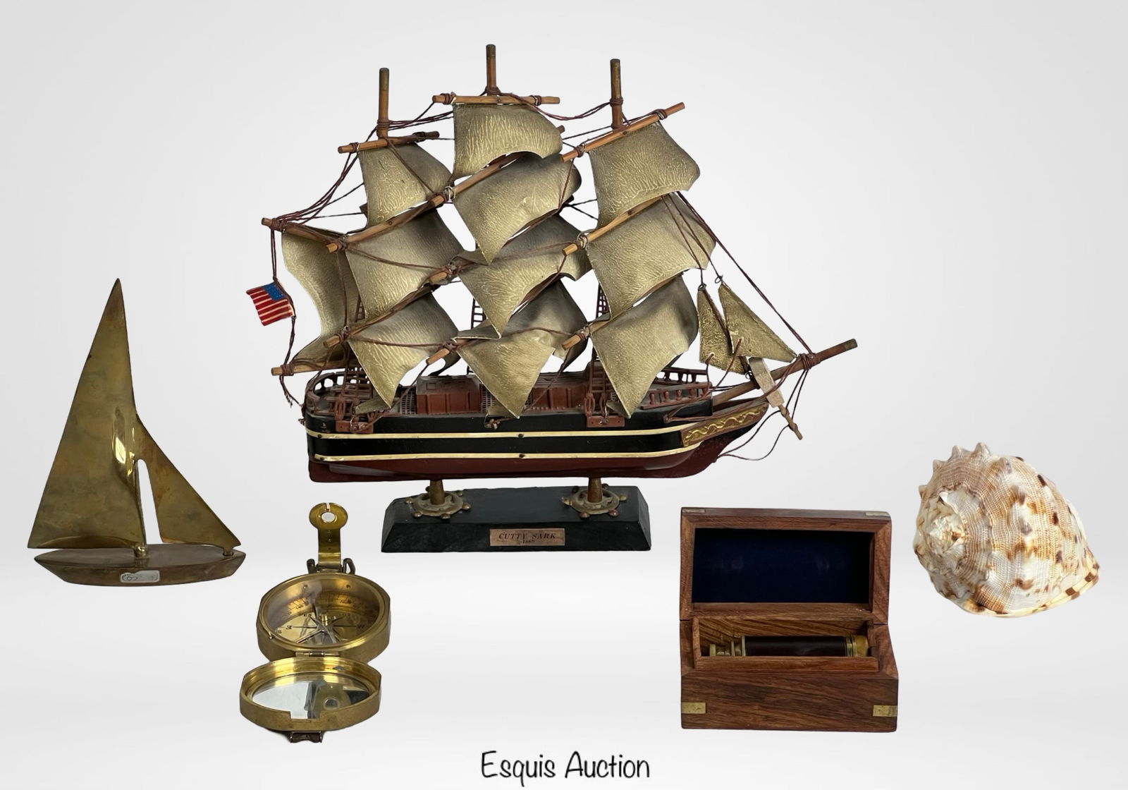 Nautical Home & Office Decor Lot: Lot of marine-themed decor items ideal includes the following: Vintage Cutty Sark 1869 Ship Model - finely detailed clipper ship replica with cloth sails, rigging, flags, and painted hull; mounted on