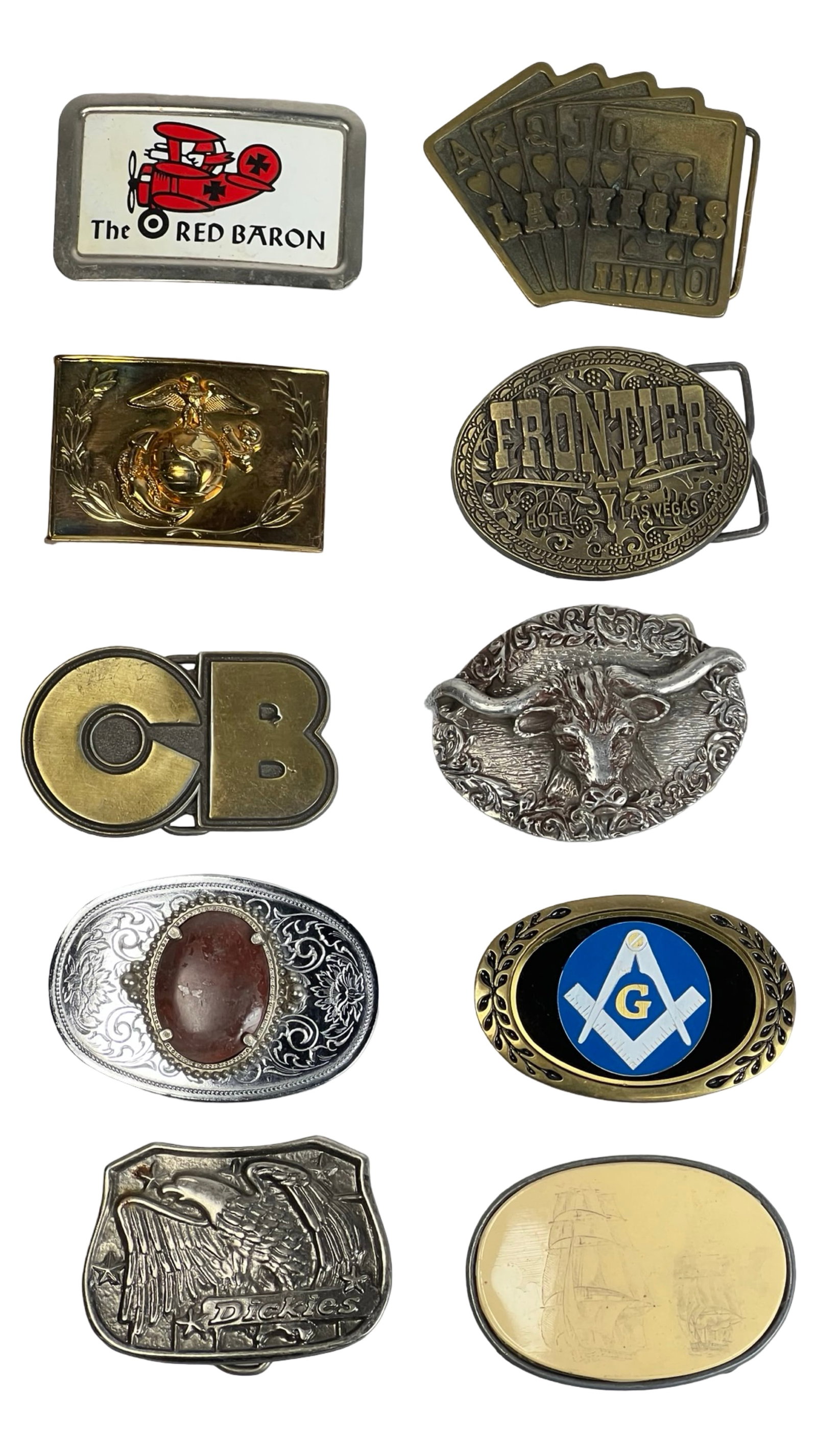 Assortment of Vintage Bet Buckles: Lot of 10 vintage and novelty belt buckles including enamel "The Red Baron," Las Vegas poker hand, USMC emblem, CB logo, Dickies eagle, Masonic symbol, longhorn steer, Frontier Hotel Las Vegas, and sc