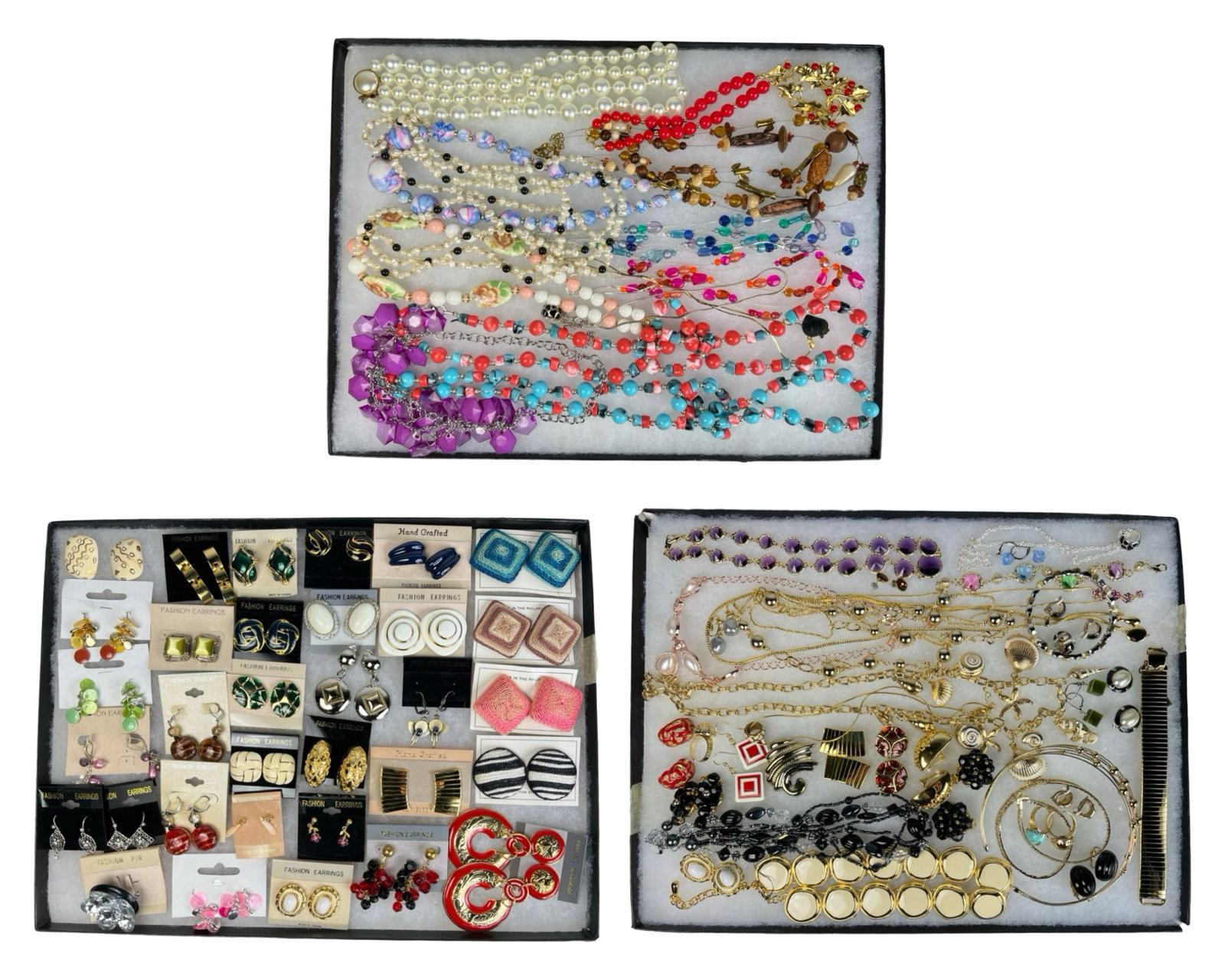 Assortment of Costume Jewelry - Sparkling Variety: Elevate your style with this dazzling Assortment of Costume Jewelry. Bursting with variety, this collection features an array of necklaces, earrings, bracelets, and more, each piece designed to add a 