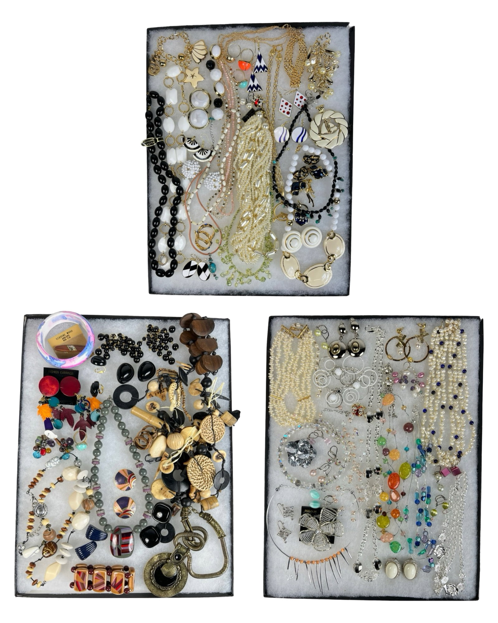 Assortment of Costume Jewelry - Sparkling Variety: Elevate your style with this dazzling Assortment of Costume Jewelry. Bursting with variety, this collection features an array of necklaces, earrings, bracelets, and more, each piece designed to add a 