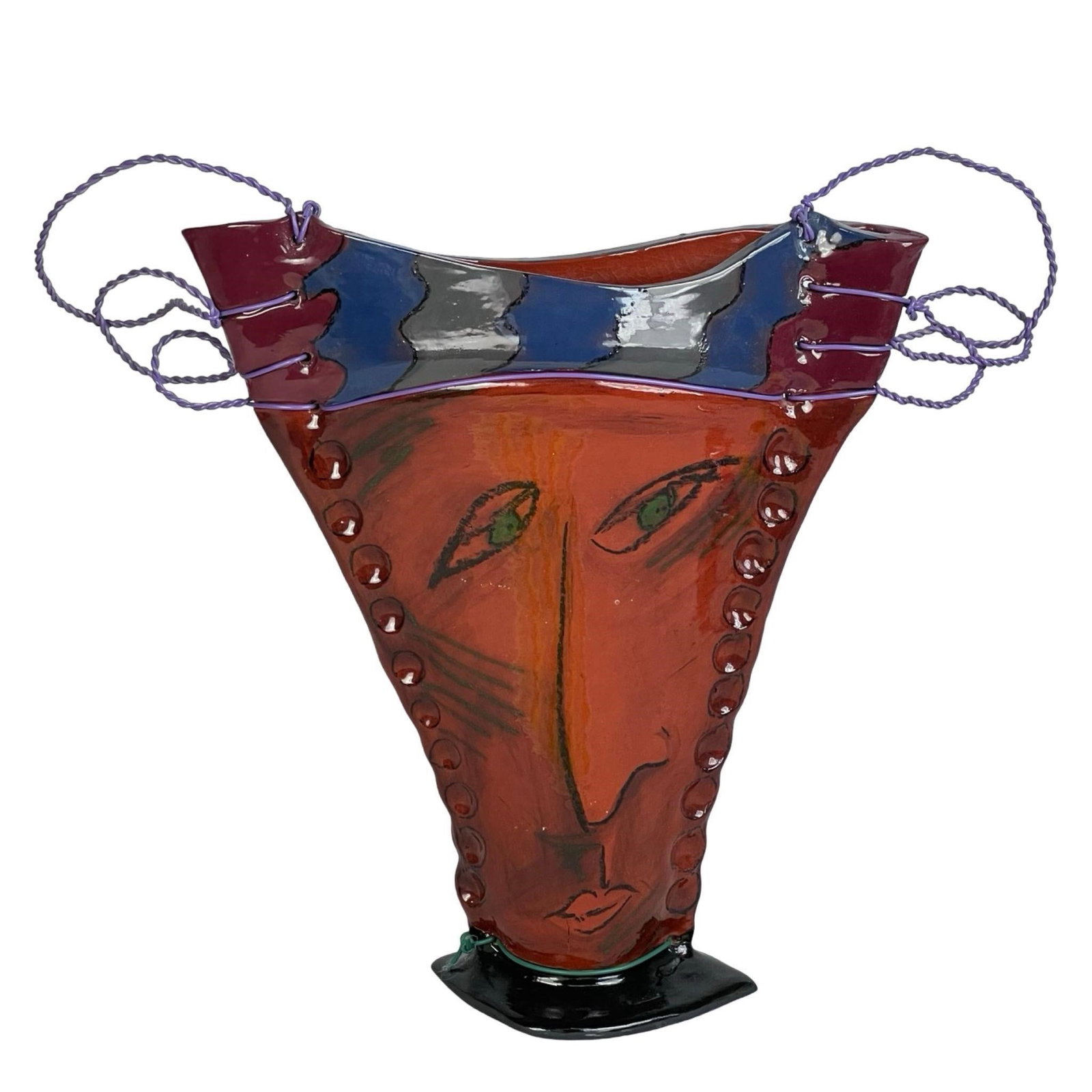 Contemporary Modernist Art Glass Face Vase: This striking contemporary art glass vase features a stylized face motif rendered in bold, abstract lines, reminiscent of modernist and cubist influences. The piece showcases a vibrant palette with ex