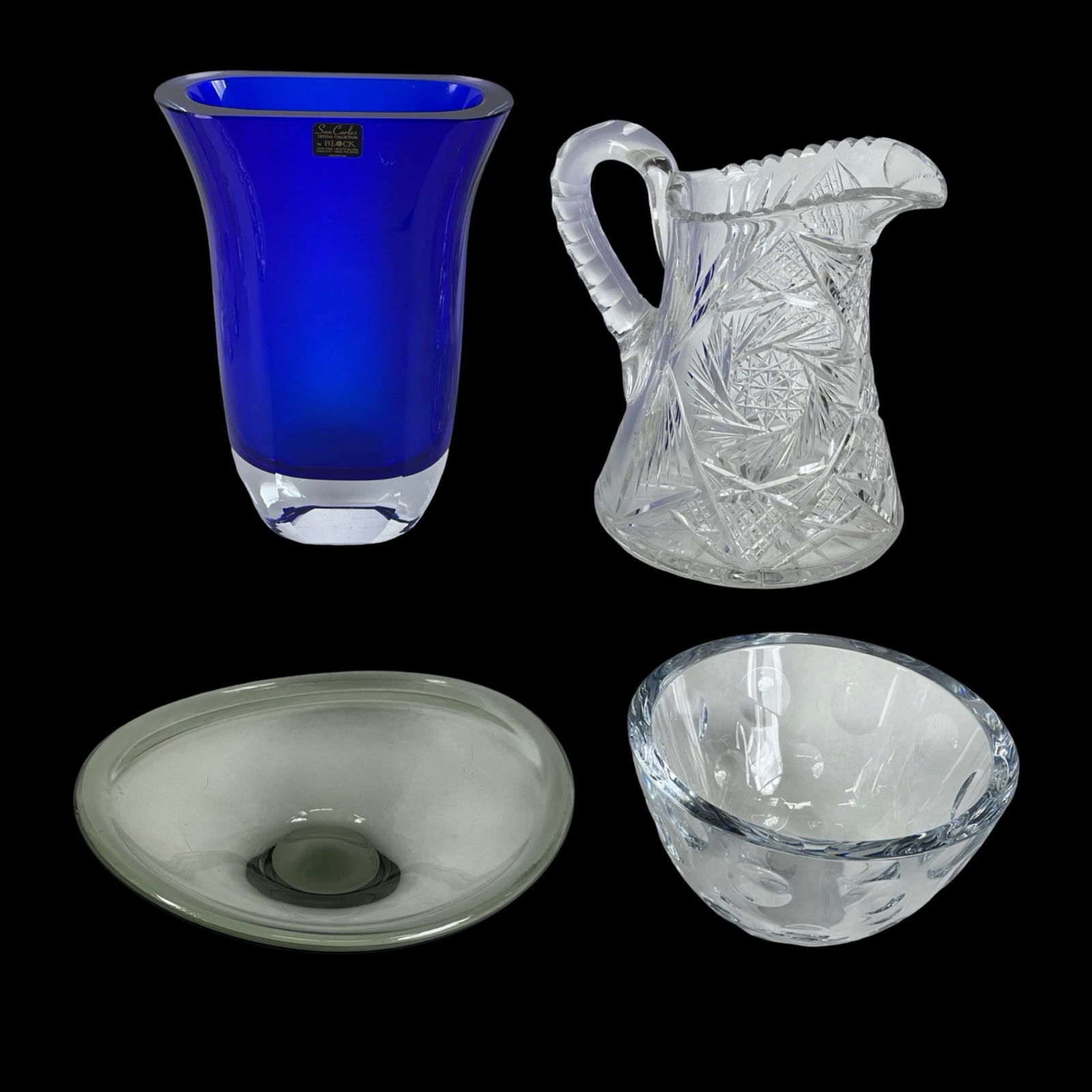 Fine Art & Cut Glass- Holmegaard, Saaki, ABP: This lot features a striking assortment of four decorative glass pieces. The Holmegaard Selandia bowl, designed by Per Lutken in Denmark, is crafted from smoky gray art glass with a freeform, undulati