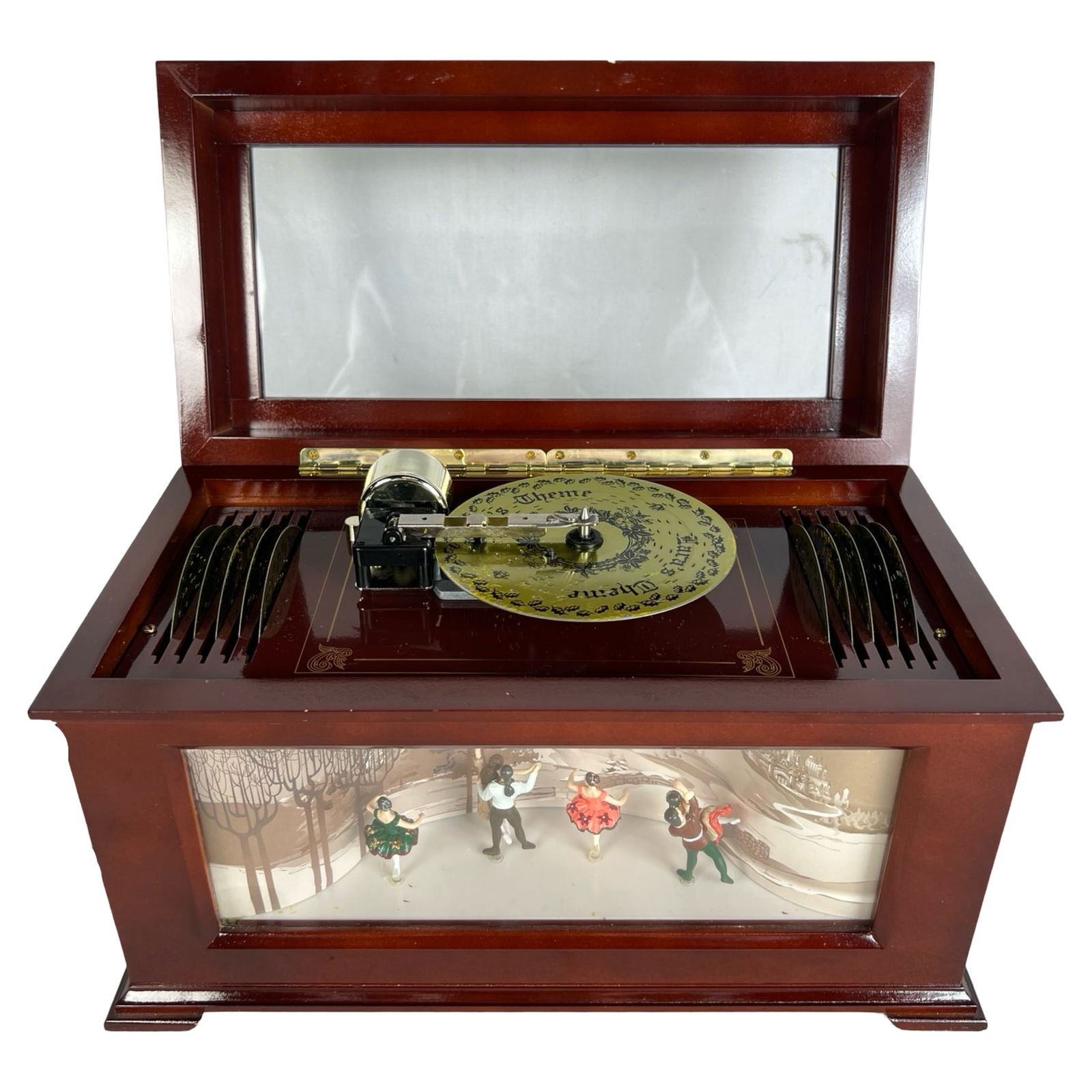 Mr. Christmas Animated Music Box: Beautifully crafted by Mr. Christmas, this animated music box combines sound and movement in a charming wooden case with a glass viewing window. Includes 16 interchangeable metal music discs featuring