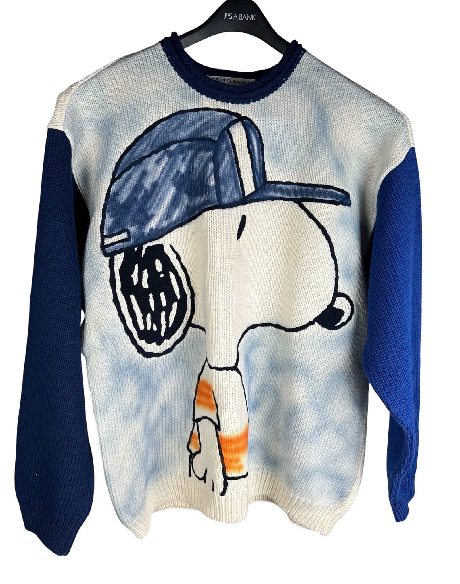 JC De Castelbajac Snoopy Sweater: JC De Castelbajac Snoopy sweater featuring a bold graphic of Snoopy in a baseball cap across the front. Designed with contrasting blue sleeves and a tie-dye style background. Size 58. Playful and vibr