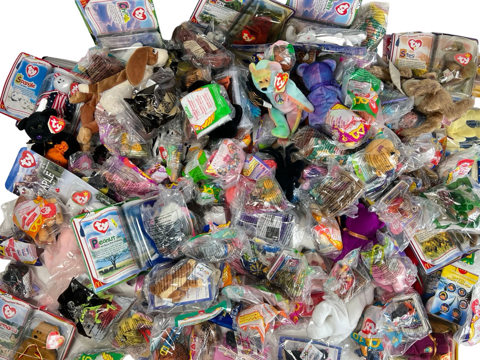 Vintage McDonald's Happy Meal Toys & Ty Beanie Ba: xtensive collection featuring a wide variety of vintage McDonald's Happy Meal toys and Ty Beanie Babies, most still sealed in original packaging. Includes several special editions such as Internationa