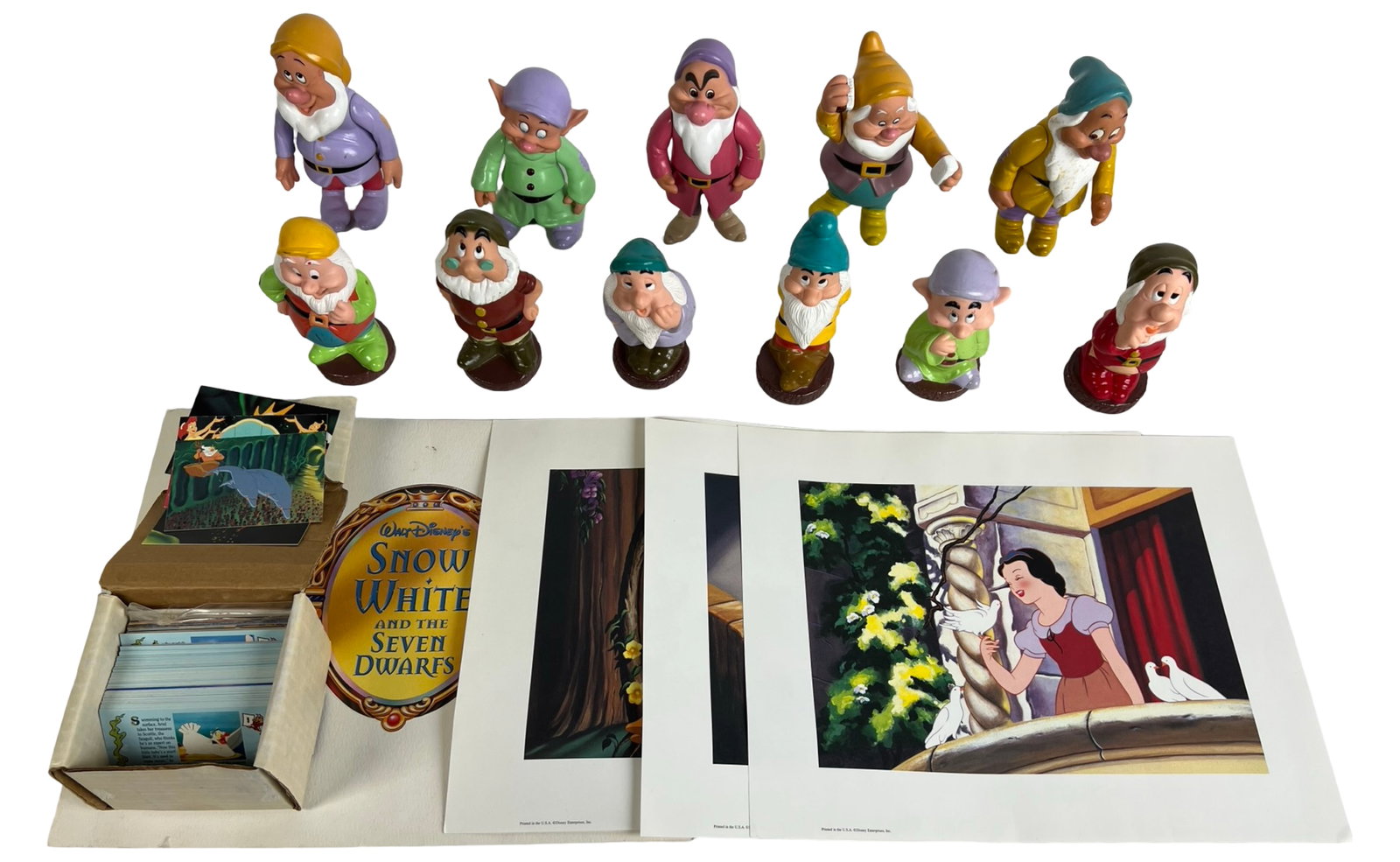 Disney Snow White Dwarf Collection with Lithos &: This Disney collectibles lot features lot of twelve rubber figurines from Snow White and the Seven Dwarfs, with each dwarf measuring approximately 5 to 7 inches tall. The figures are brightly painted