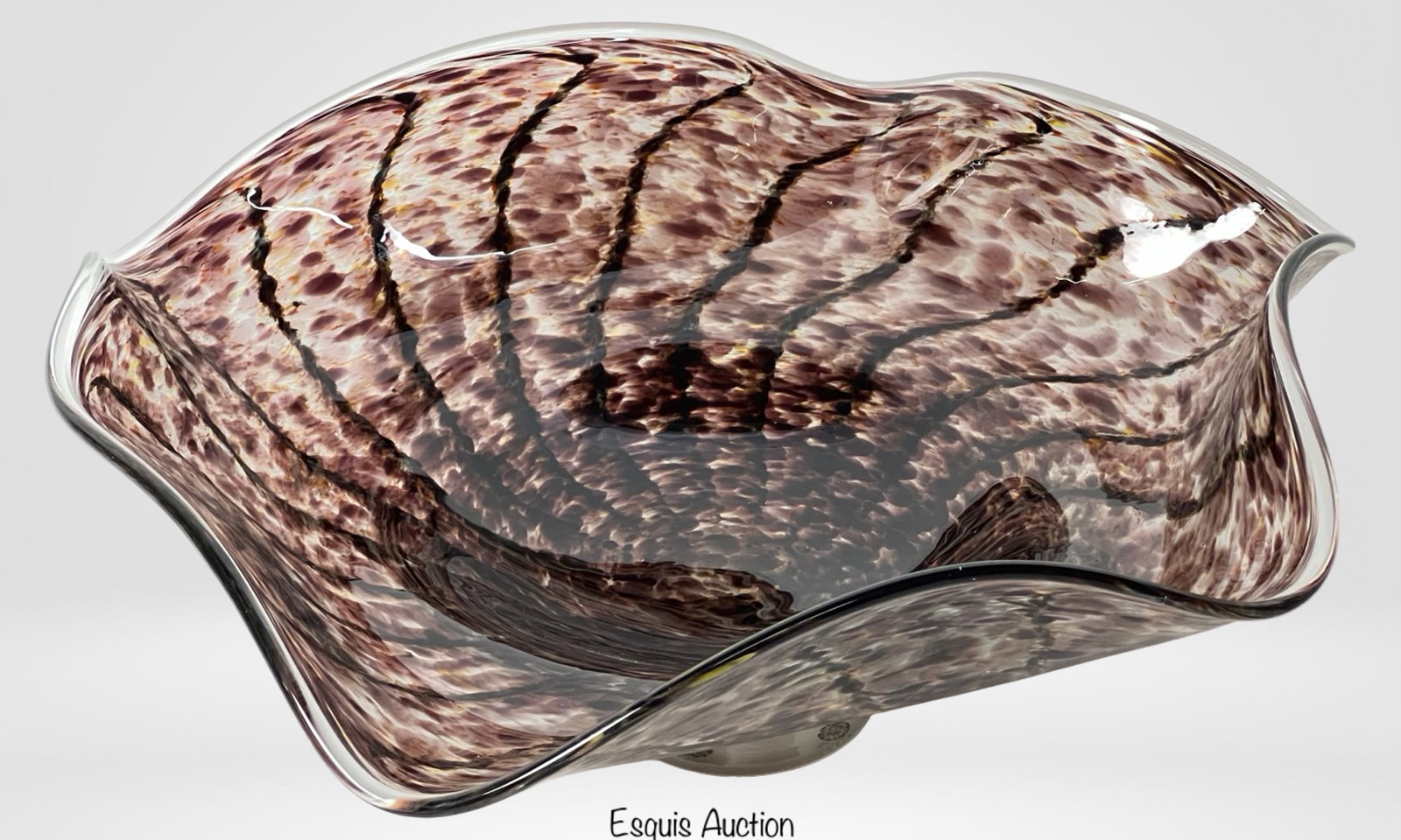 Contemporary Japanese Art Glass Centerpiece Bowl: Striking contemporary Japanese art glass centerpiece bowl featuring a dramatic free-form design with fluid, undulating edges. The surface displays a richly speckled pattern in tones of deep plum, ambe