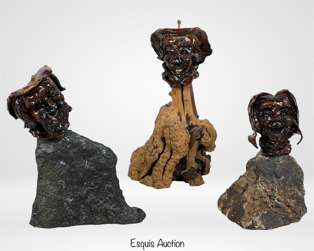 Shep Shapiro Applehead Folk Art Trio: Group of three whimsical hand-carved folk art busts by artist Shep Shapiro, featuring expressive "applehead" faces mounted on natural stone and driftwood bases. Each piece is uniquely sculpted and fin