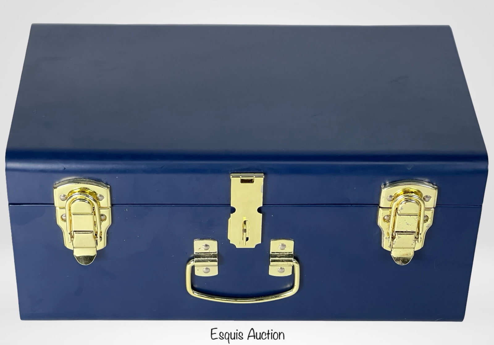 Petite Keep Classic Keepsakes Trunk: Navy blue Petite Keep keepsake trunk featuring a soft blue gingham fabric lining. This classic trunk is finished with gold-tone hardware and a secure front latch, offering a charming and secure way to