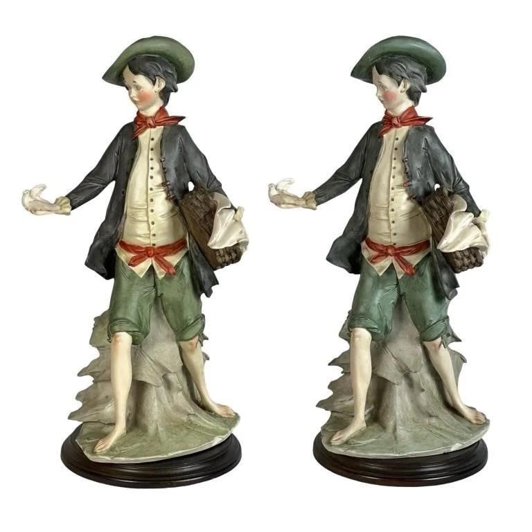 Pair Large Giuseppe Armani Capodimonte Figurines: This elegant pair of large Capodimonte-style figurines by Giuseppe Armani depicts young men in 18th-century attire, posed with expressive gestures and fine detail. Standing 20 inches tall and mounted