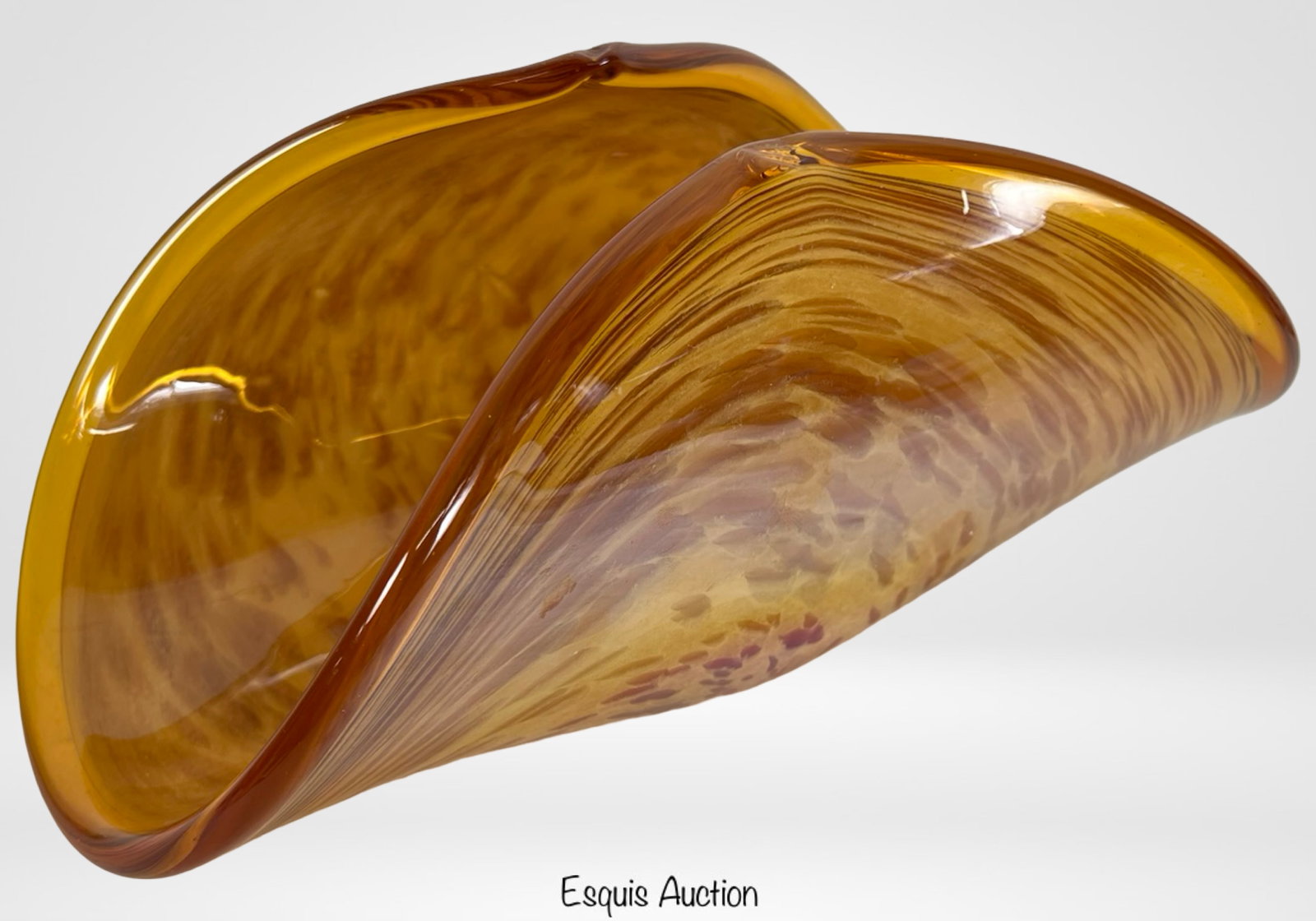 Murano Hand-Blown Art Glass Sculptural Bowl: This striking hand-blown art glass bowl from Murano, Italy, showcases the exceptional craftsmanship of Venetian glassmakers. Measuring approximately 14" long by 7" wide and 6 1/2" tall, the sculptural