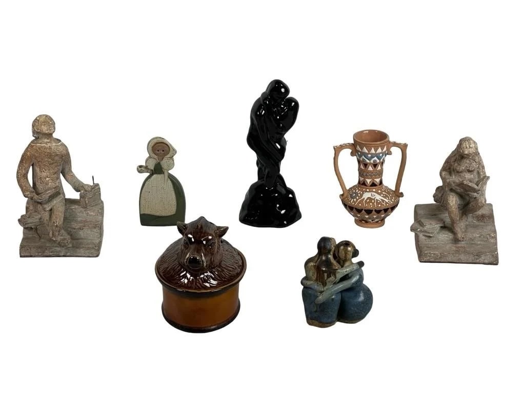 Eclectic Collection of Sculptures & Decor Pottery: This diverse grouping includes seven unique decorative pieces spanning various styles and materials. Featured is a Portuguese Majolica boar-head tureen with rich glaze and sculptural detail, and a pai