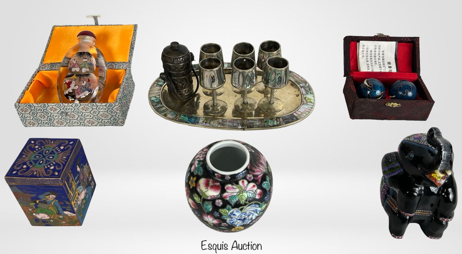 Lot of Mostly Chinese Small Decorative Objects: Diverse group of mostly Chinese decorative items, including a reverse-painted snuff bottle in silk-lined box, cloisonne Baoding exercise balls in presentation case, black enamel floral ginger jar, and