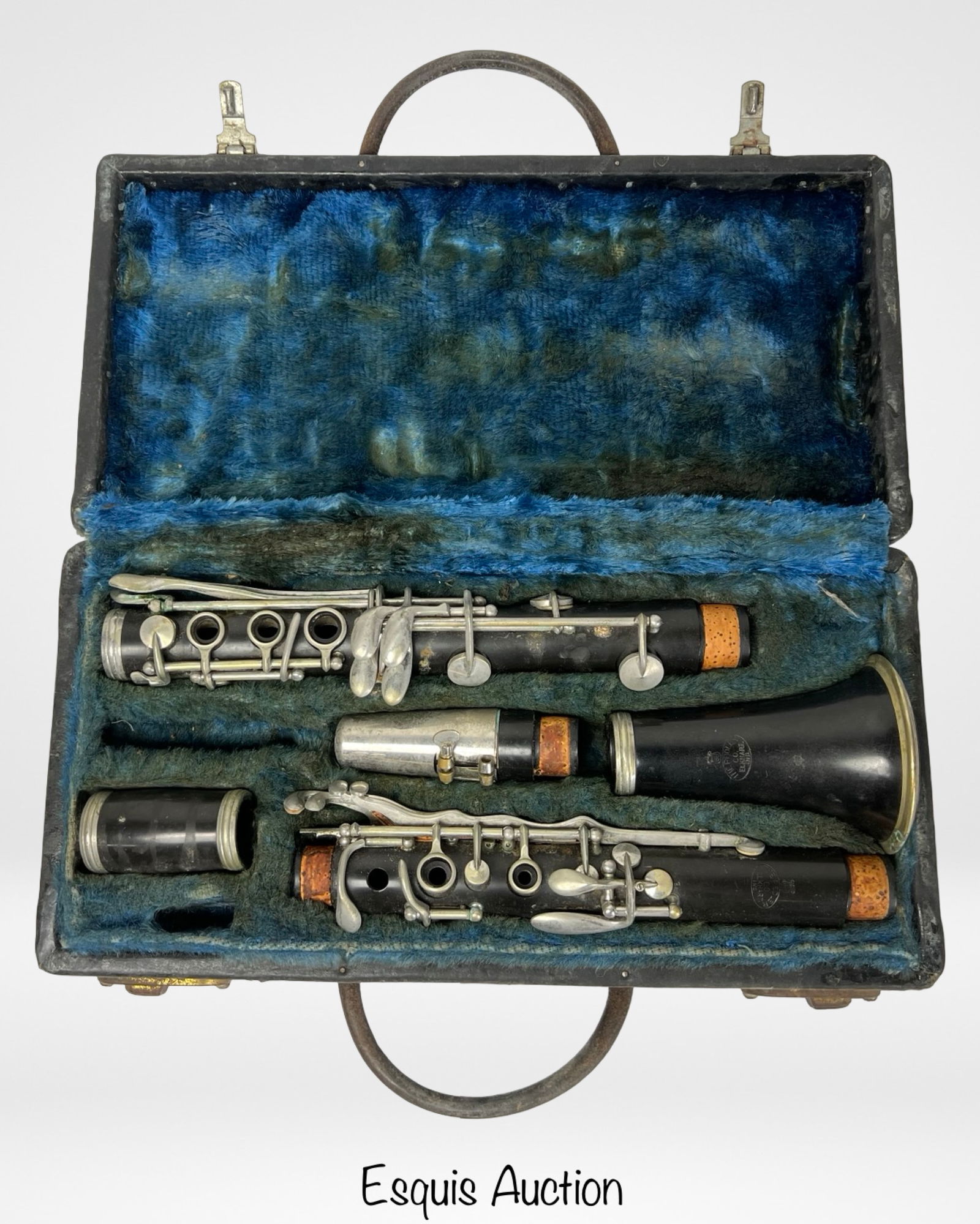 Vintage Pedler Co. Clarinet - Elkhart, Indiana: Vintage clarinet by The Pedler Co., Elkhart, Indiana, presented in its original hard case with blue velvet lining. The clarinet appears to be made of wood with nickel-plated keys and cork fittings. Al
