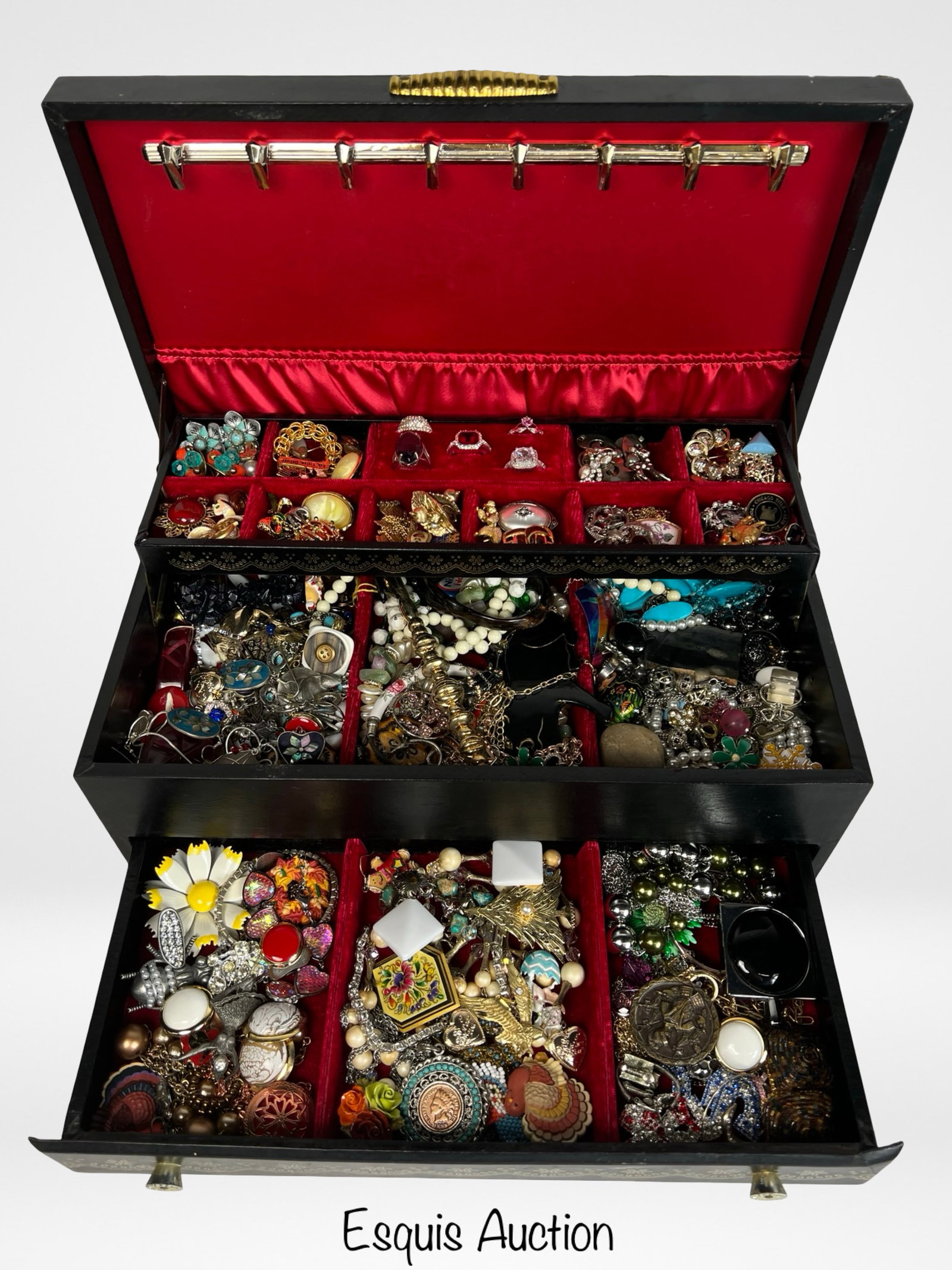 Vintage Jewelry Box Filled with Unsearched Jewelry: A charming vintage jewelry box featuring multiple compartments lined in rich red velvet, brimming with a variety of unsearched jewelry. This treasure trove includes an assortment of necklaces, earring