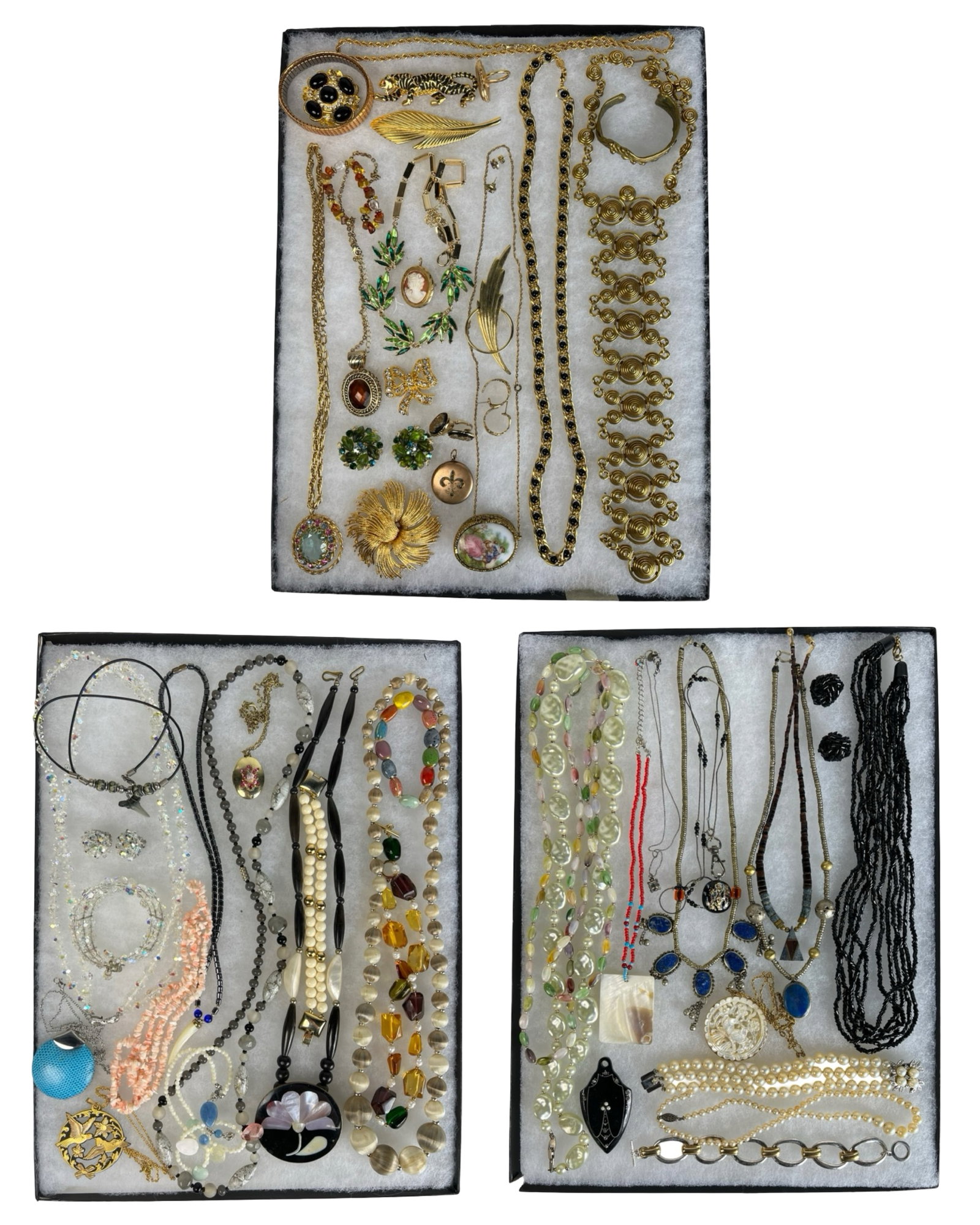 Assortment of Costume Jewelry - Sparkling Variety: Elevate your style with this dazzling Assortment of Costume Jewelry. Bursting with variety, this collection features an array of necklaces, earrings, bracelets, and more, each piece designed to add a 