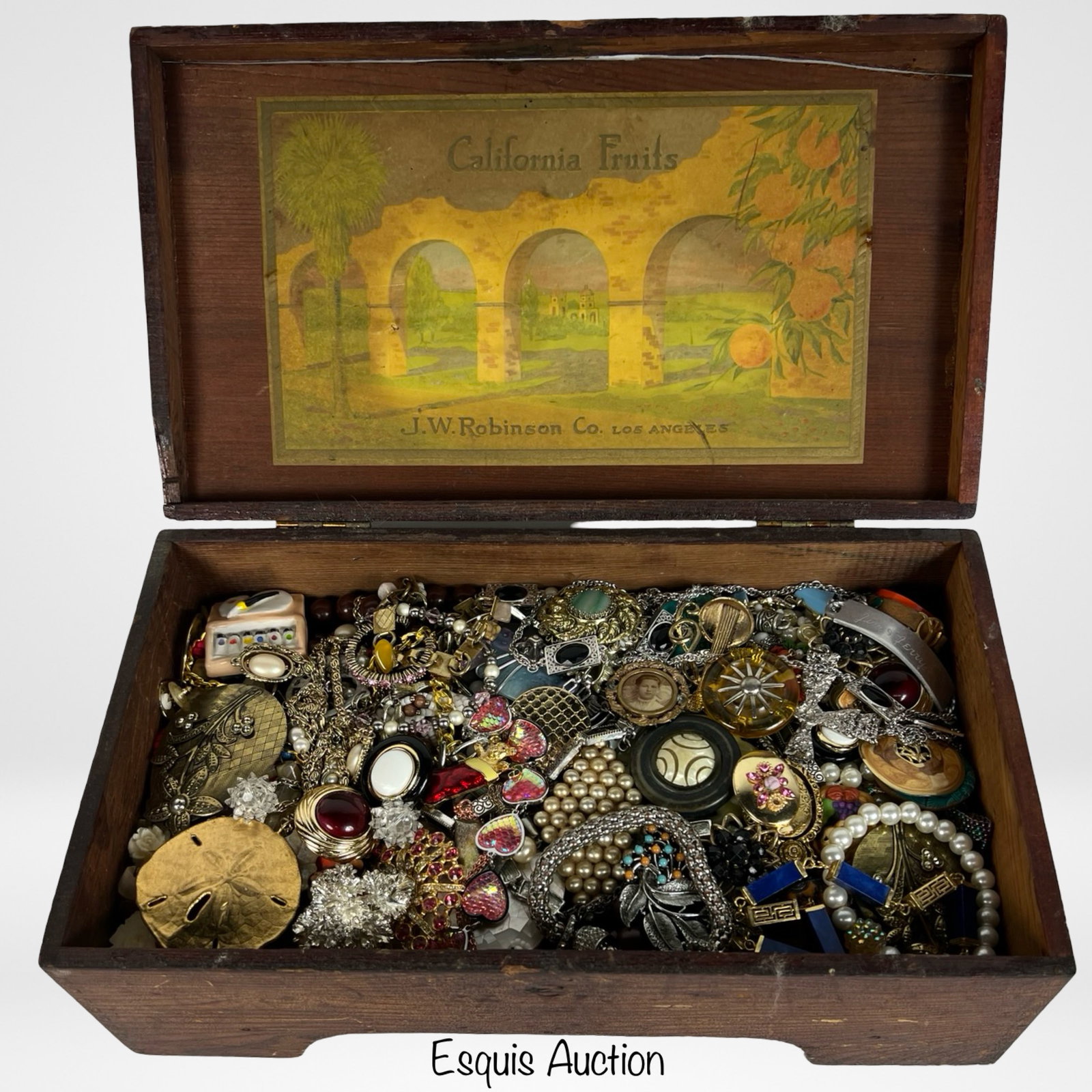 Vintage Jewelry Box Filled with Unsearched Jewelry: A charming vintage jewelry box featuring multiple compartments lined in rich red velvet, brimming with a variety of unsearched jewelry. This treasure trove includes an assortment of necklaces, earring