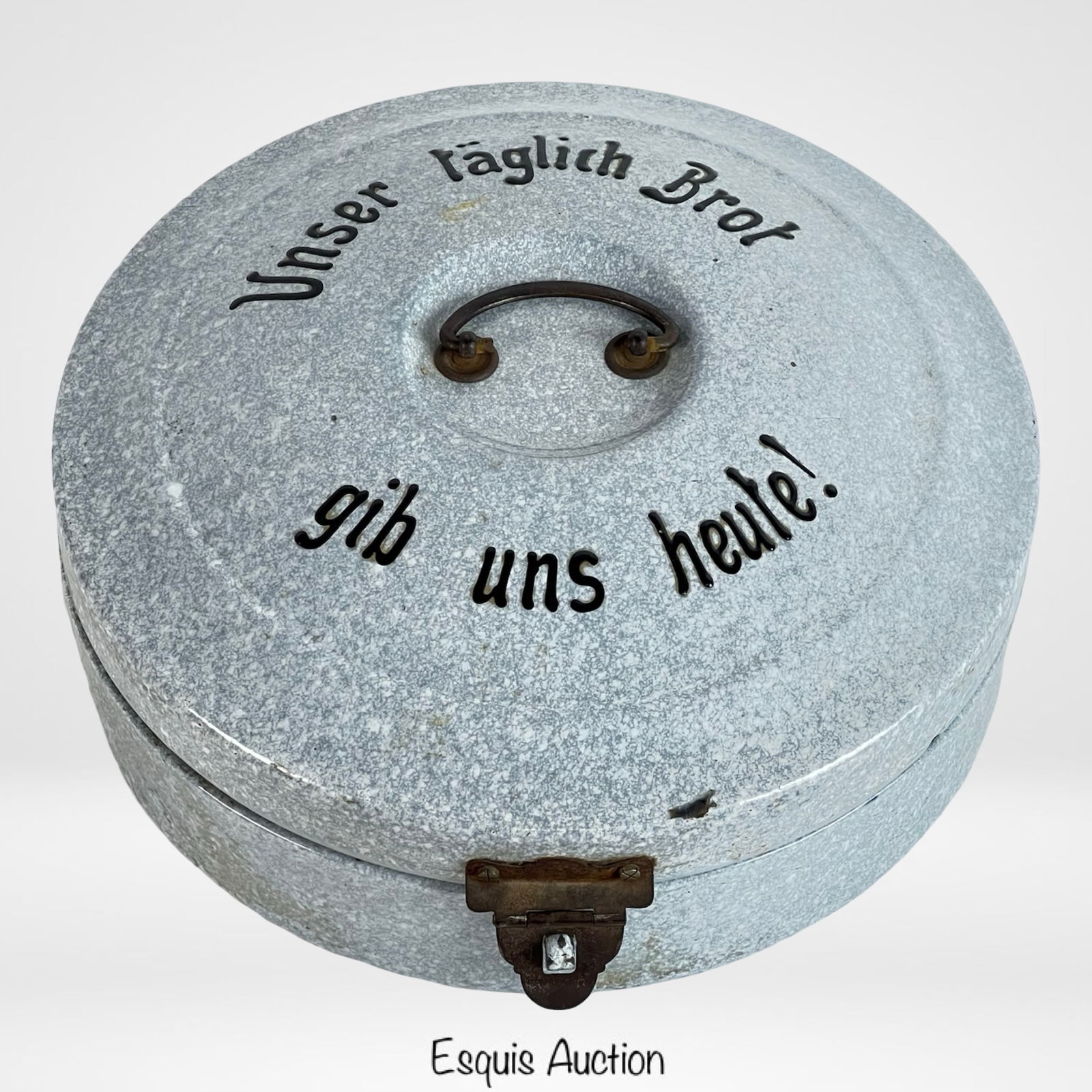 Antique German Enamel Bread Box: A round antique German bread box made of enamel-coated metal, featuring a hinged lid with clasp closure and a central handle. The lid is inscribed in German with the phrase "Unser tÃ¤glich Brot gib