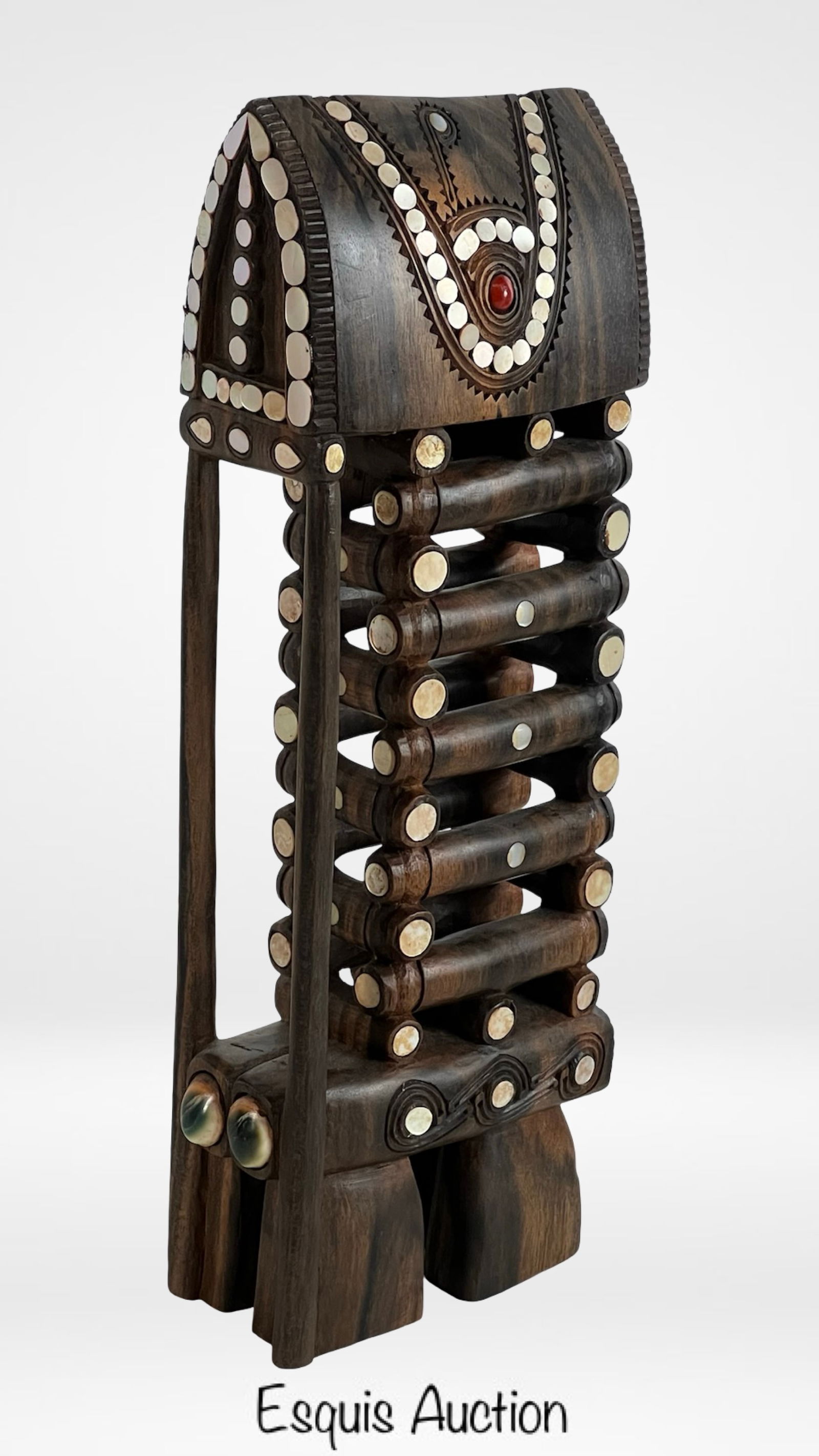 Hand-Carved Trobriand Islands Yam House Sculpture: An intricately hand-carved wooden yam house sculpture from the Trobriand Islands, crafted from dense Pacific hardwood (likely ebony) and adorned with mother-of-pearl shell inlay and red bead accents.