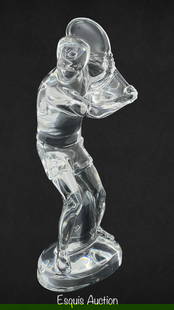 Baccarat French Crystal Tennis Player Sculpture: Elegant and dynamic Baccarat crystal figurine depicting a tennis player in mid-swing. Expertly crafted from clear crystal, this 9 1/4" tall sculpture captures the energy and motion of the athlete with
