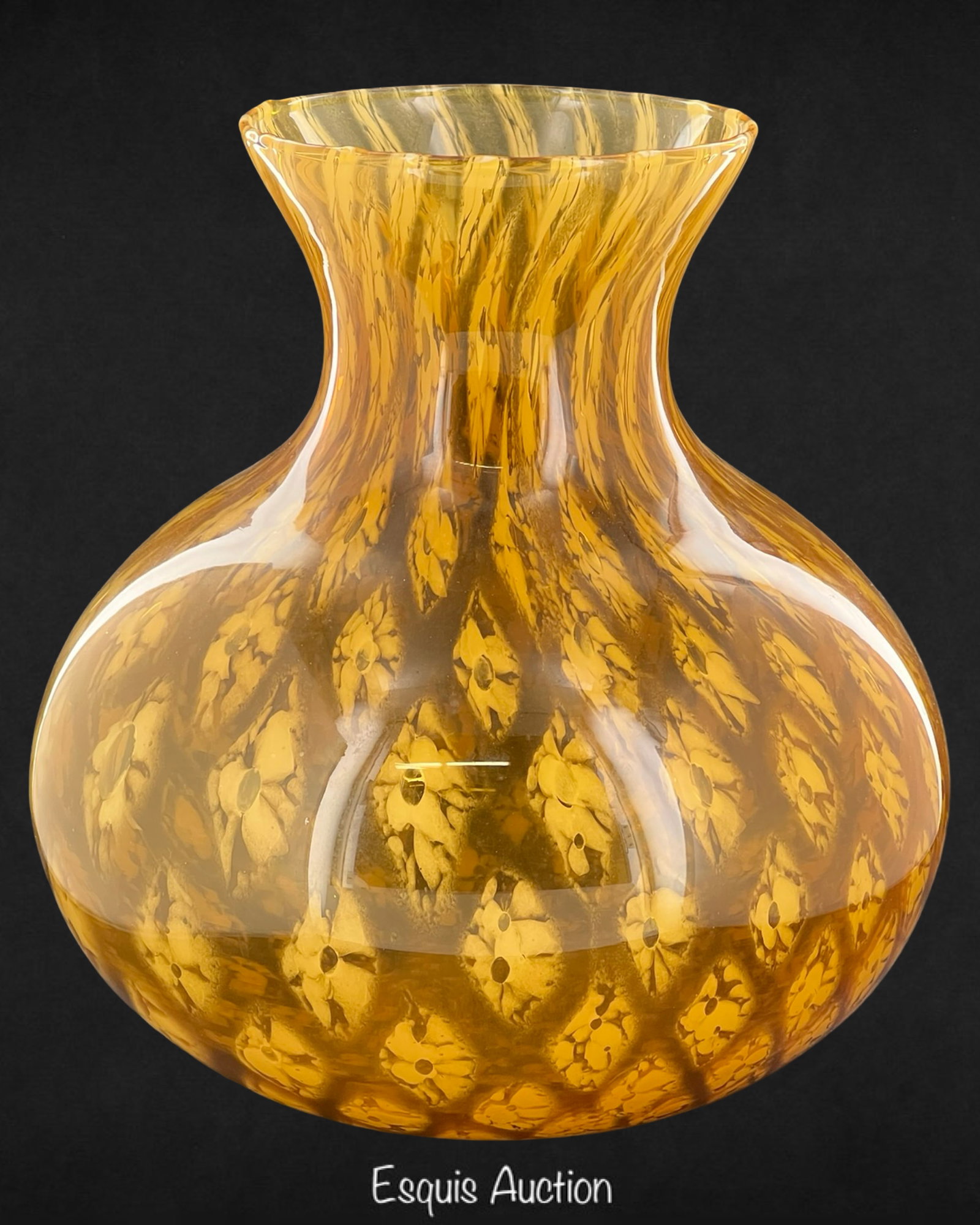 Maestri Vetrai Venetian Handblown Art Glass Vase: Impressive handblown art glass vase by Maestri Vetrai, Venice, featuring a rich amber tone and intricate millefiori-style floral inclusions suspended within the glass. The bulbous body transitions to 