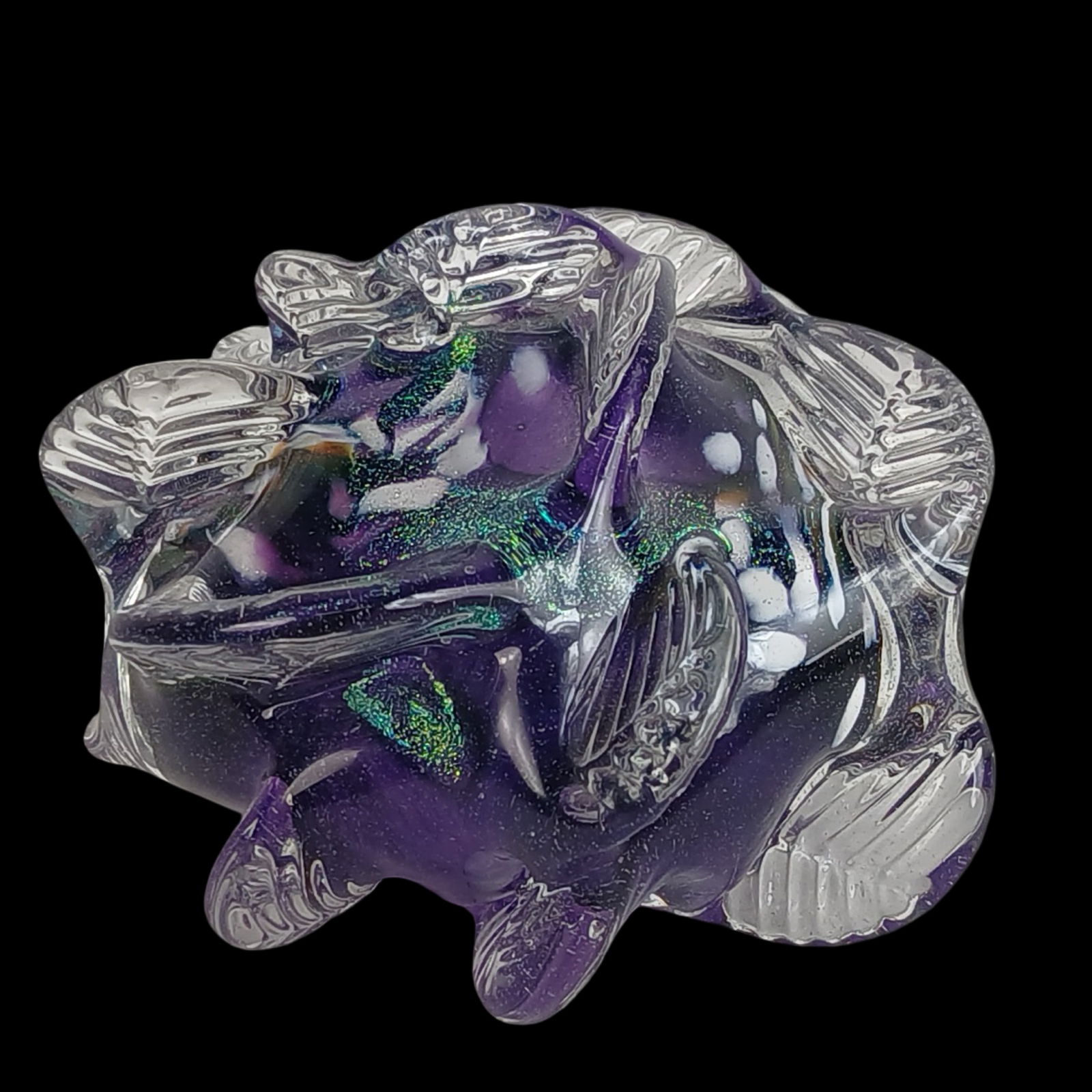 Freeform Dichroic Art Glass Paperweight, Signed: Striking freeform art glass paperweight featuring rich layers of purple and clear glass with embedded dichroic highlights that shimmer in green and blue. The surface is intricately worked with sculpte