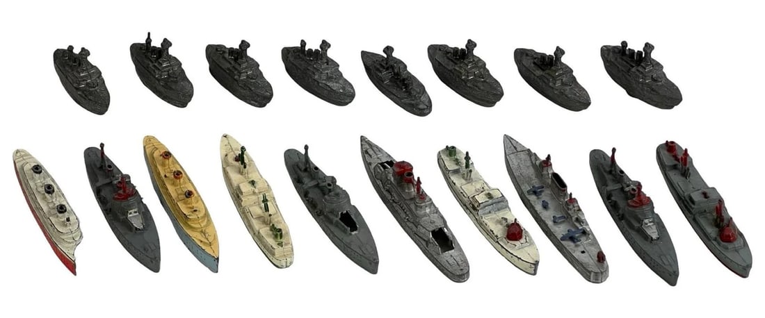 Vintage TootsieToy Die-Cast Battleships & Cruisers: This collection includes 17 vintage TootsieToy die-cast naval ships, showcasing battleships and cruisers in varying designs and colors. Condition ranges from well-preserved to signs of age-related wea