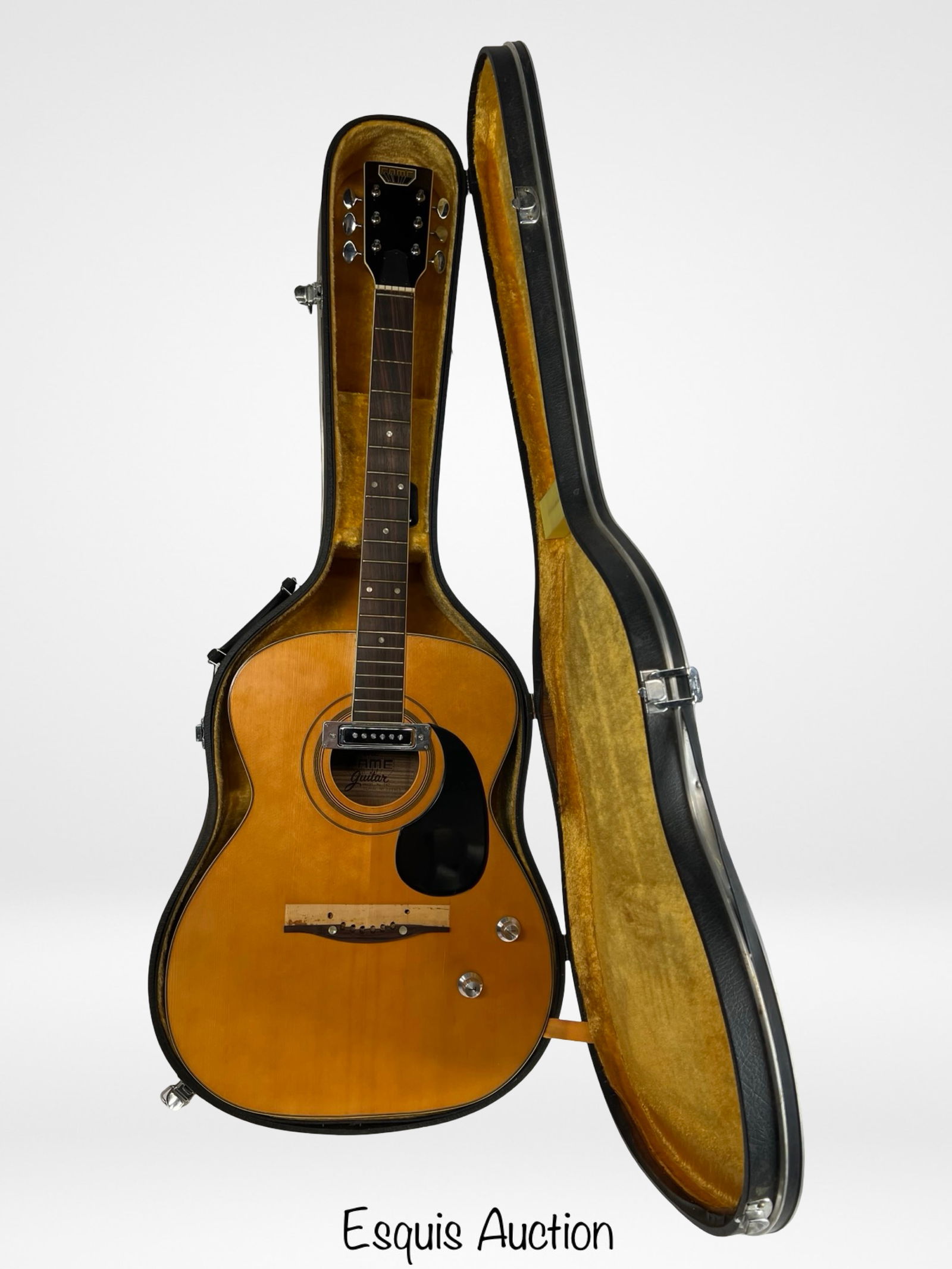 Vintage Fame Model 747 Acoustic-Electric Guitar: This vintage Fame Model 747 acoustic-electric guitar, made in Japan, features a natural finish spruce top with beautifully grained rosewood back and sides. Fitted with a single-coil soundhole pickup a