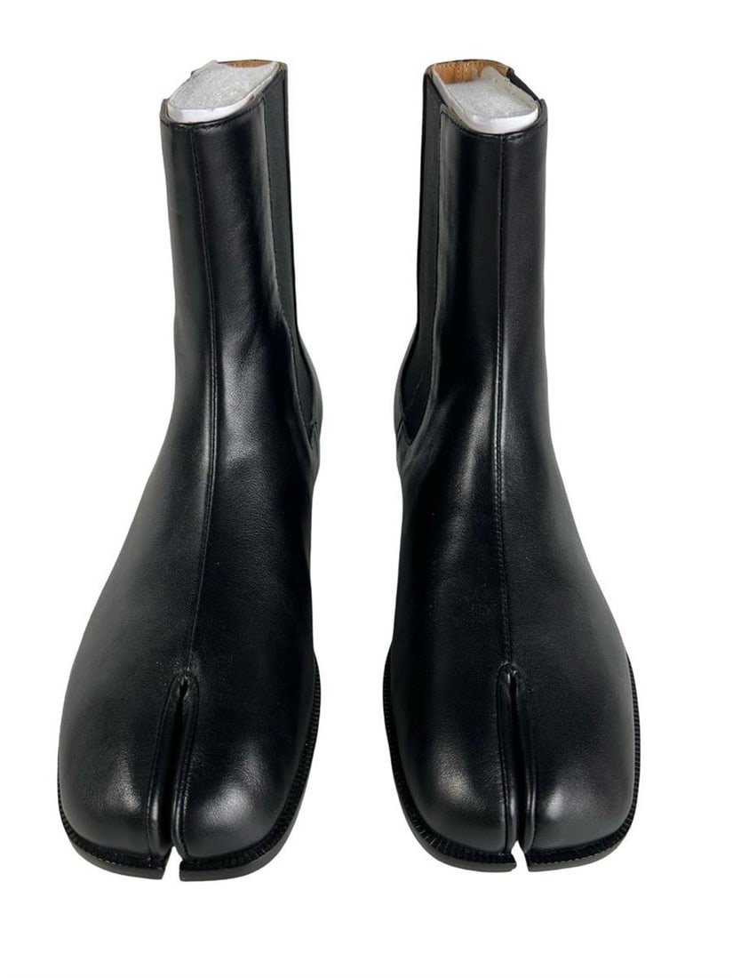 Men's Tabi Chelsea Boots Brushed Calfskin Leather: Men's Tabi Chelsea boots crafted in brushed calfskin leather, featuring the signature split-toe design and a sleek minimalist silhouette. Size 43. Boots are in new condition with clean soles and no vi