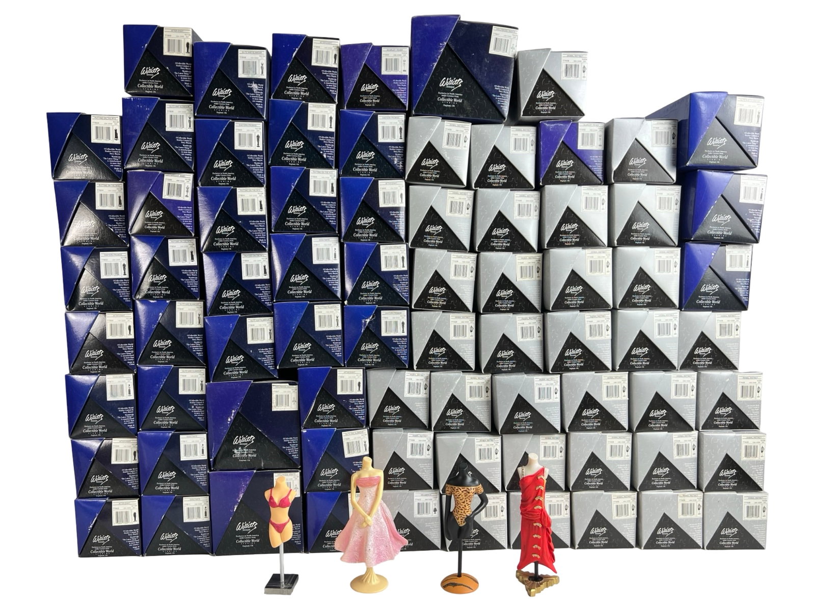 "The Latest Thing" Fashion Mannequin Figurines: Collection of "The Latest Thing" fashion mannequin figurines, each presented in its original box. These stylish miniature dress forms showcase a range of iconic outfits, from elegant eveningwear to pl