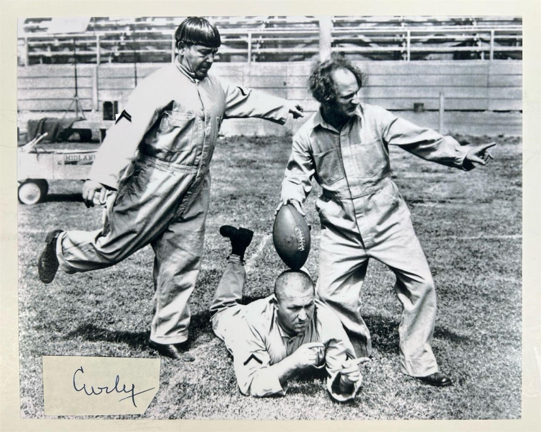 Curly "Stooge" Signature w/ 3 Stooges Photo: Curly Howard Signature Cut, a truly exceptional and rare piece of memorabilia from one of the most iconic members of the classic comedy trio, The Three Stooges. Comes with 8*10 "3 Stooges" Photograph.