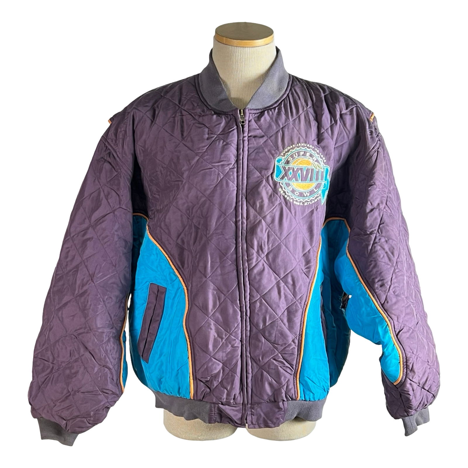 1994 Super Bowl XXVIII Atlanta Jacket: Vintage Super Bowl XXVIII commemorative jacket by U.S. Silk, featuring bold embroidery from the 1994 game held at the Georgia Dome in Atlanta. Made of 100% silk with a nylon lining, this quilted jacke