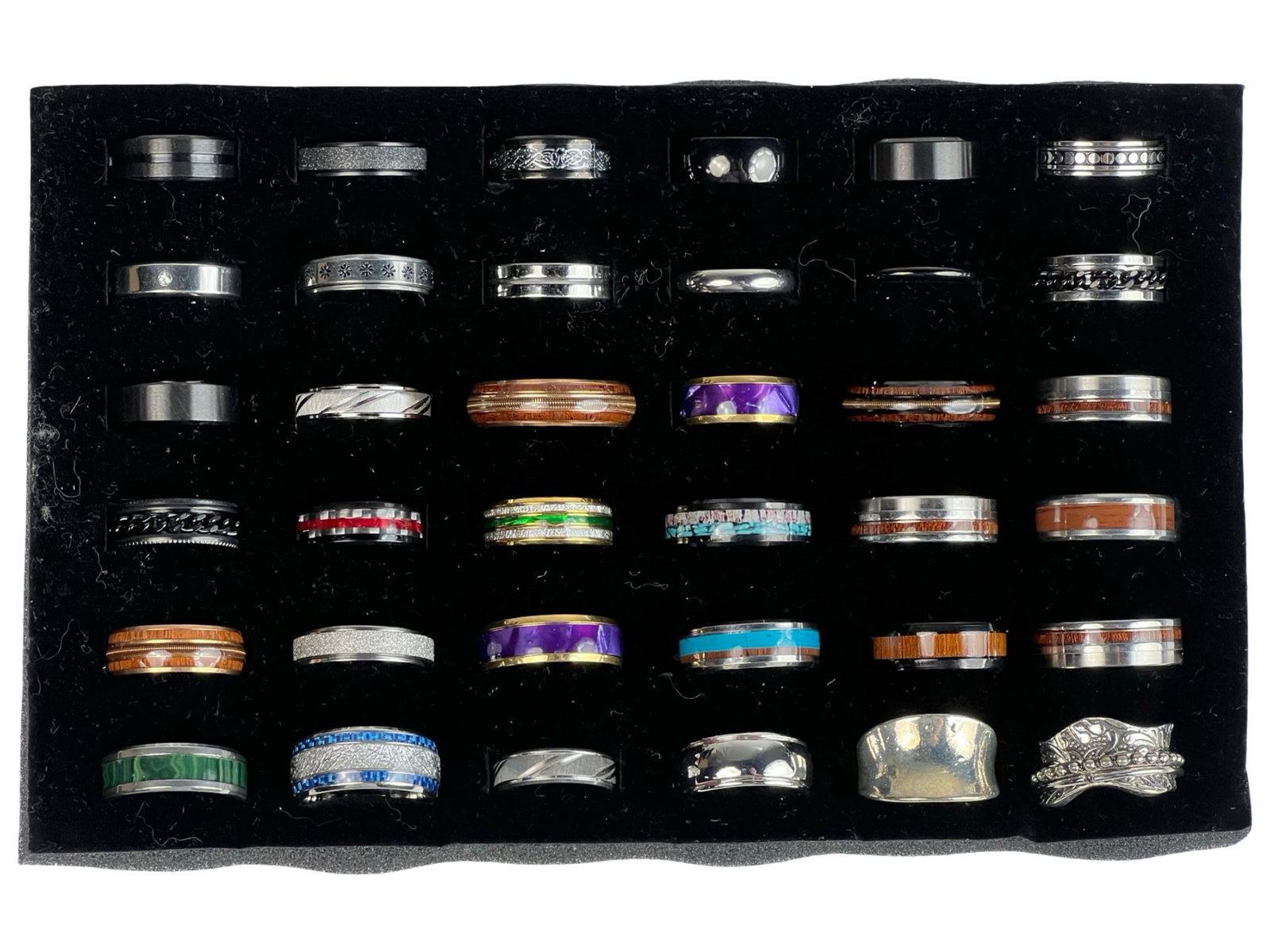 Collection of 36 Band Rings: Discover the timeless elegance of simplicity with this collection of 36 band rings. Each ring is a versatile and classic accessory, perfect for everyday wear or special occasions.Display is not includ