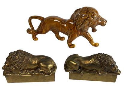 Pair of Brass Lion Bookends After Antonio Canova &: egant pair of cast brass lion bookends modeled after the renowned sleeping lions by neoclassical sculptor Antonio Canova (1757-1822). Each lion is finely detailed, resting on a rectangular base with t