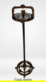 Art Deco 1920s Cast Iron Floor Standing Ashtray: This striking Art Deco standing ashtray from the 1920s features an intricately cast iron frame with elegant scroll and grapevine motifs, characteristic of the era's ornamental design. Ashtray is 31 in