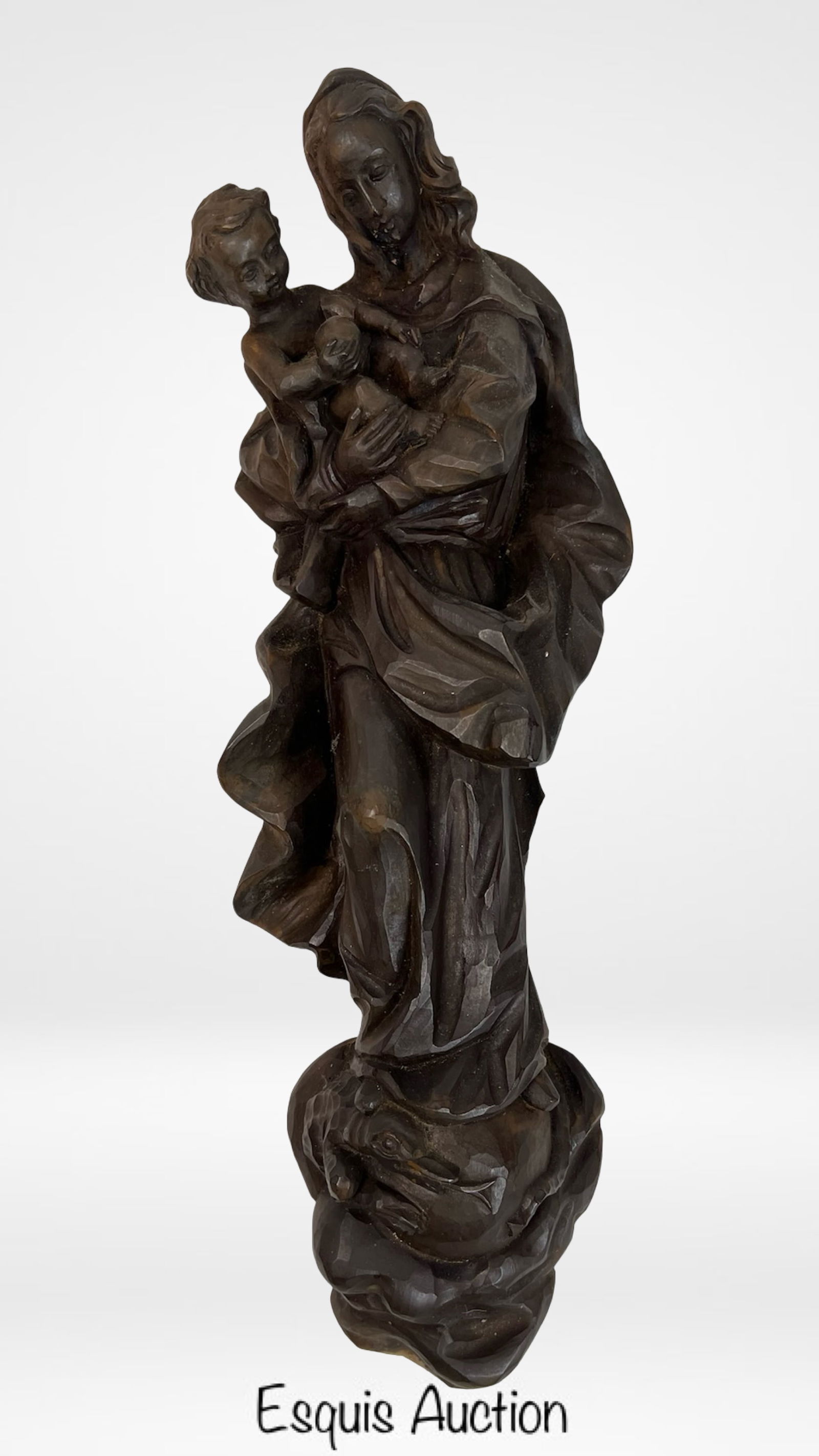 Antique Carved Wood Madonna and Child Wall Plaque: This beautifully hand-carved wooden wall plaque features the Madonna tenderly holding the Christ Child in a flowing, draped robe. The expressive figures are sculpted with remarkable depth and emotion,