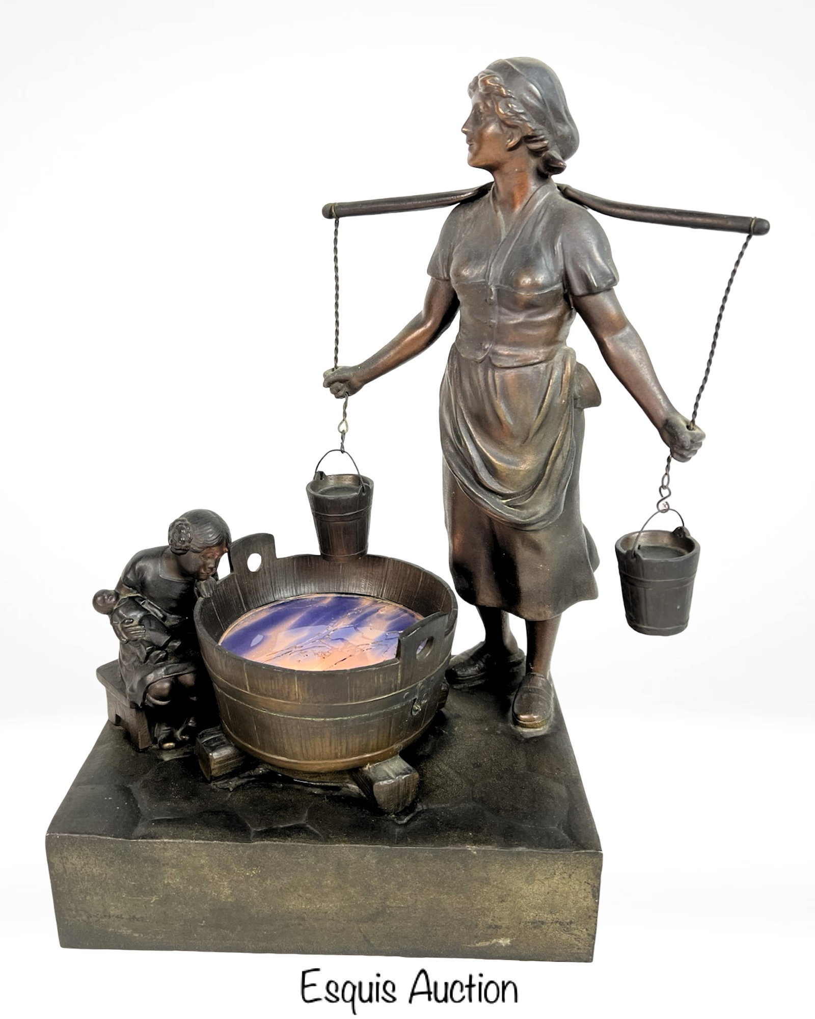 1924 Oswald Schimmelpfennig Scenic Figural Lamp: Charming and evocative, this early 20th-century night lamp depicts a tender domestic scene with a woman balancing water buckets on a yoke as a young child, cradling a doll, gazes into a glowing wash b