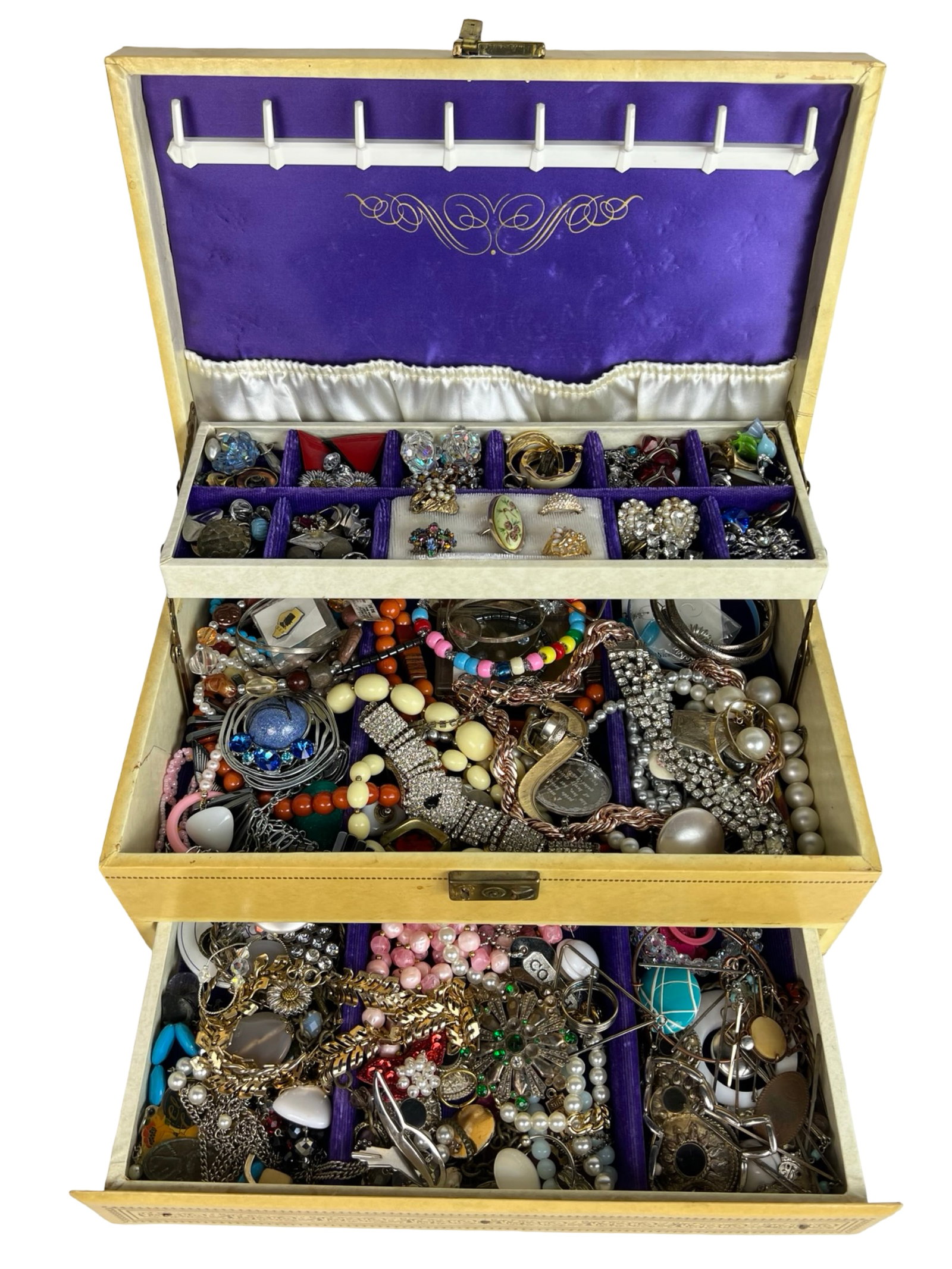 Large Jewelry Box Full of Unsearched Vintage Jewel: Discover a treasure trove within a large jewelry box brimming with unsearched vintage jewelry. Each piece holds the allure of bygone eras, featuring an assortment of necklaces, bracelets, rings, and e