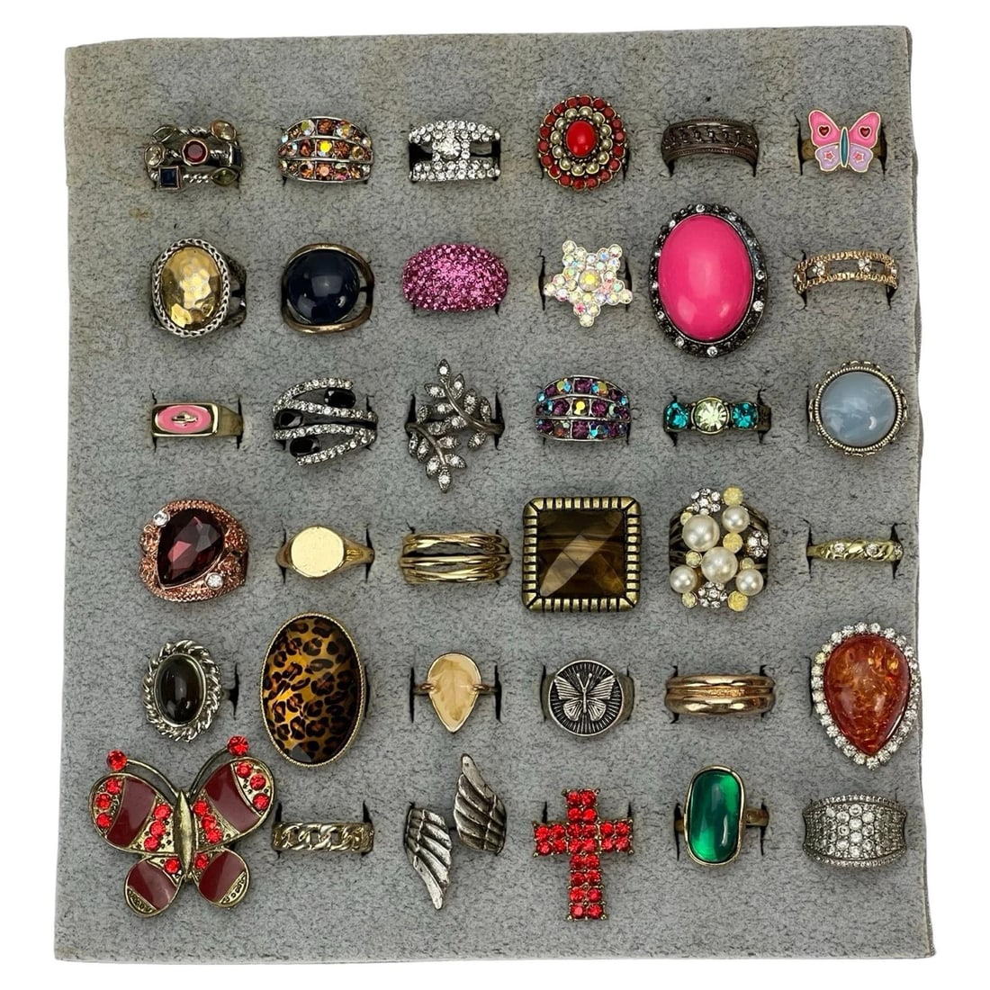 Elegance for Every Finger- Collection of Rings: Indulge in the allure of elegant adornments with this exquisite Collection of 36 Various Rings. From timeless classics to contemporary statements, this assortment caters to diverse tastes, offering a 