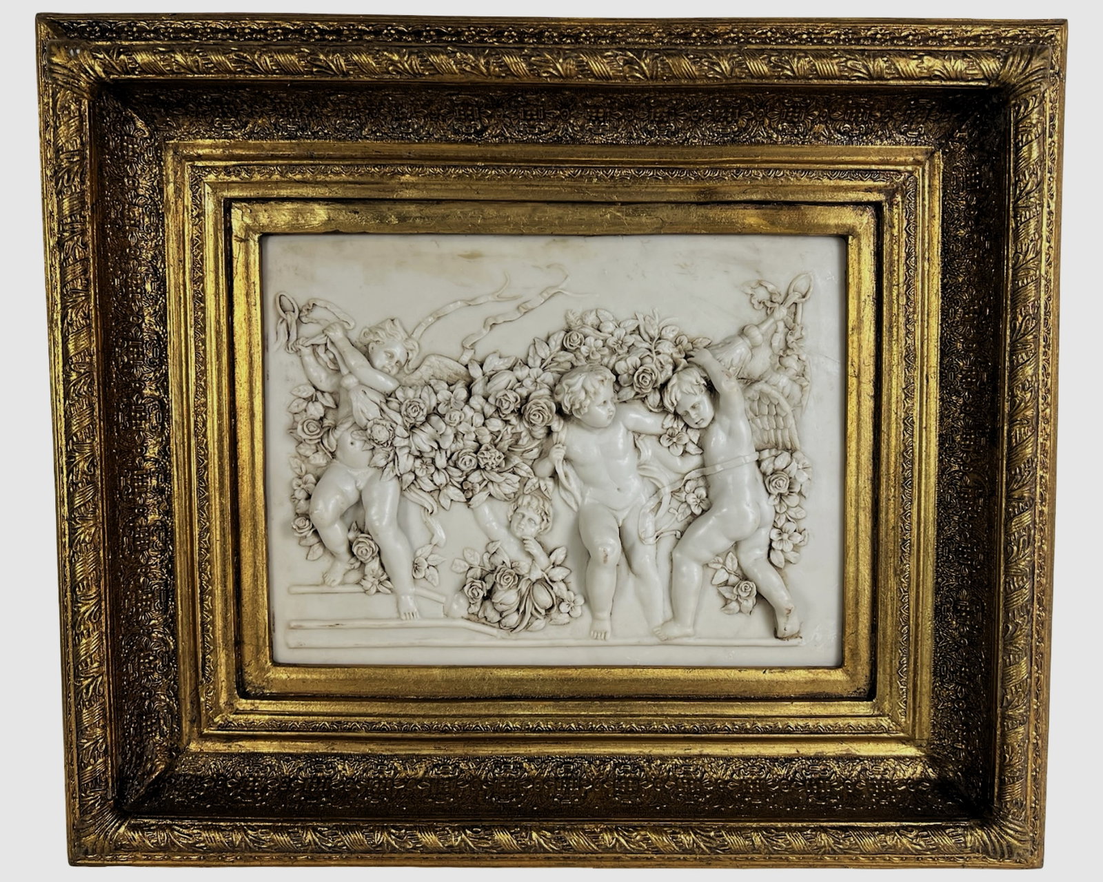 Francois Duquesnoy (After) - Bas Relief of Cherubs: Elegant neoclassical bas relief after François Duquesnoy, featuring a group of playful cherubs or putti intertwined with an opulent garland of roses and foliage. The sculptural scene is rendered in d