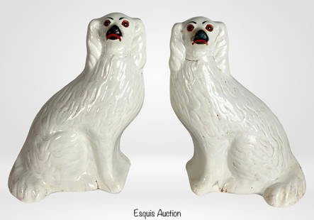 Large Vintage Staffordshire Dog Spaniel Figurines: Charming pair of vintage Staffordshire-style Spaniel dog figurines, each featuring expressive hand-painted details and classic curled ears. The figures display the traditional upright seated pose, wit