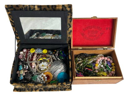 2 Boxes full of Unsearched Costume Jewelry: Delve into a world of hidden treasures with these two jewelry boxes overflowing with unsearched costume jewelry. Each box is a Pandora's box of potential, holding a mix of styles, eras, and materials