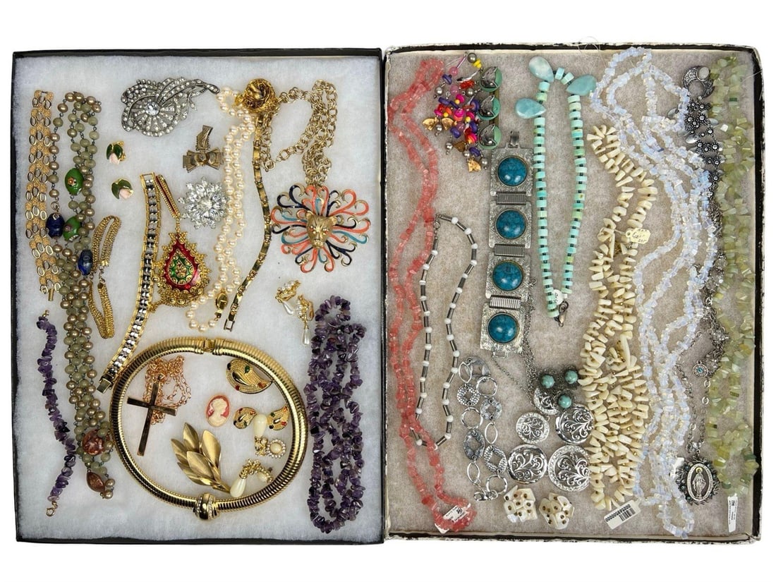 Assortment of Jewelry: A diverse collection of vintage and contemporary jewelry, including an array of necklaces, bracelets, brooches, earrings, and pendants. This assortment features various designs, from intricate filigre