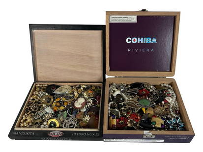 2 Boxes of Unsearched Costume Jewelry: An exciting lot of two boxes brimming with a mix of unsearched costume jewelry. This collection may include an array of necklaces, bracelets, earrings, brooches, and other accessories. Perfect for res