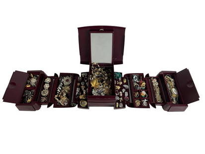 Jewelry Box Overflowing with Jewelry Treasures: Striking burgundy-toned hard case jewelry box bursting with a massive and eclectic collection of vintage costume jewelry. The multi-tiered organizer opens to reveal a dazzling assortment of unsearched