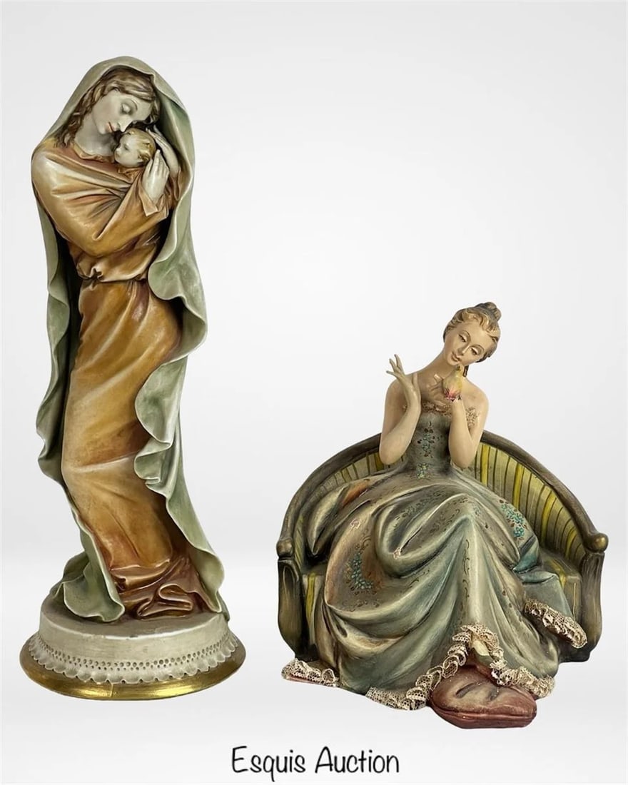 Antonio Borsato Porcelain Figurines - Madonna & L: Charming pair of Italian porcelain figurines by Antonio Borsato, each capturing his signature emotive and detailed style. The taller piece, standing 10 1/4" high, features a serene Madonna tenderly em