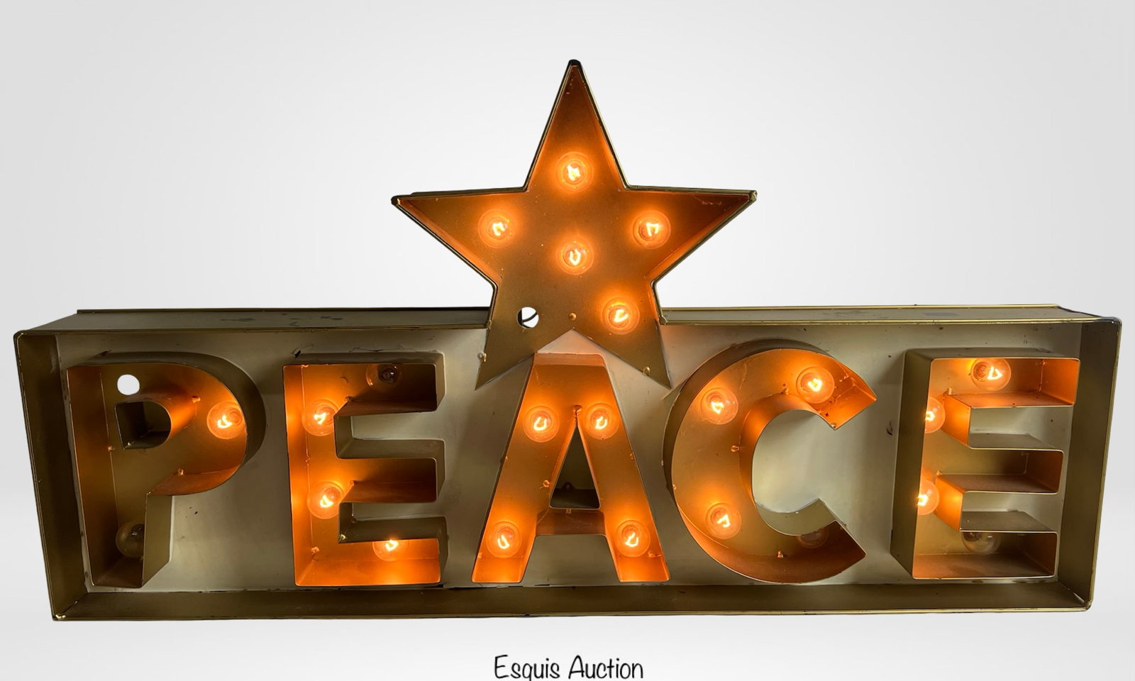 Light-Up "PEACE" Marquee Sign with Star: Light-Up "PEACE" Marquee Sign with Star. Approximately 33" x 17". Fully functional with warm glowing bulbs; a few bulbs may need replacement. Bold and festive décor piece ideal for holiday displays o